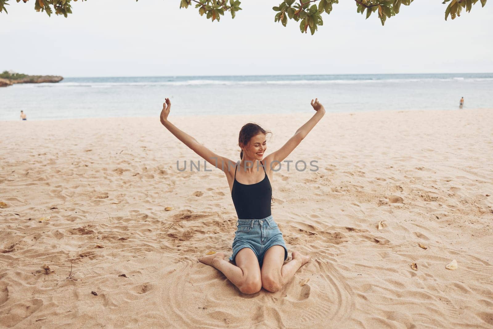 beach woman sitting vacation sand freedom smile nature sea beauty travel by SHOTPRIME