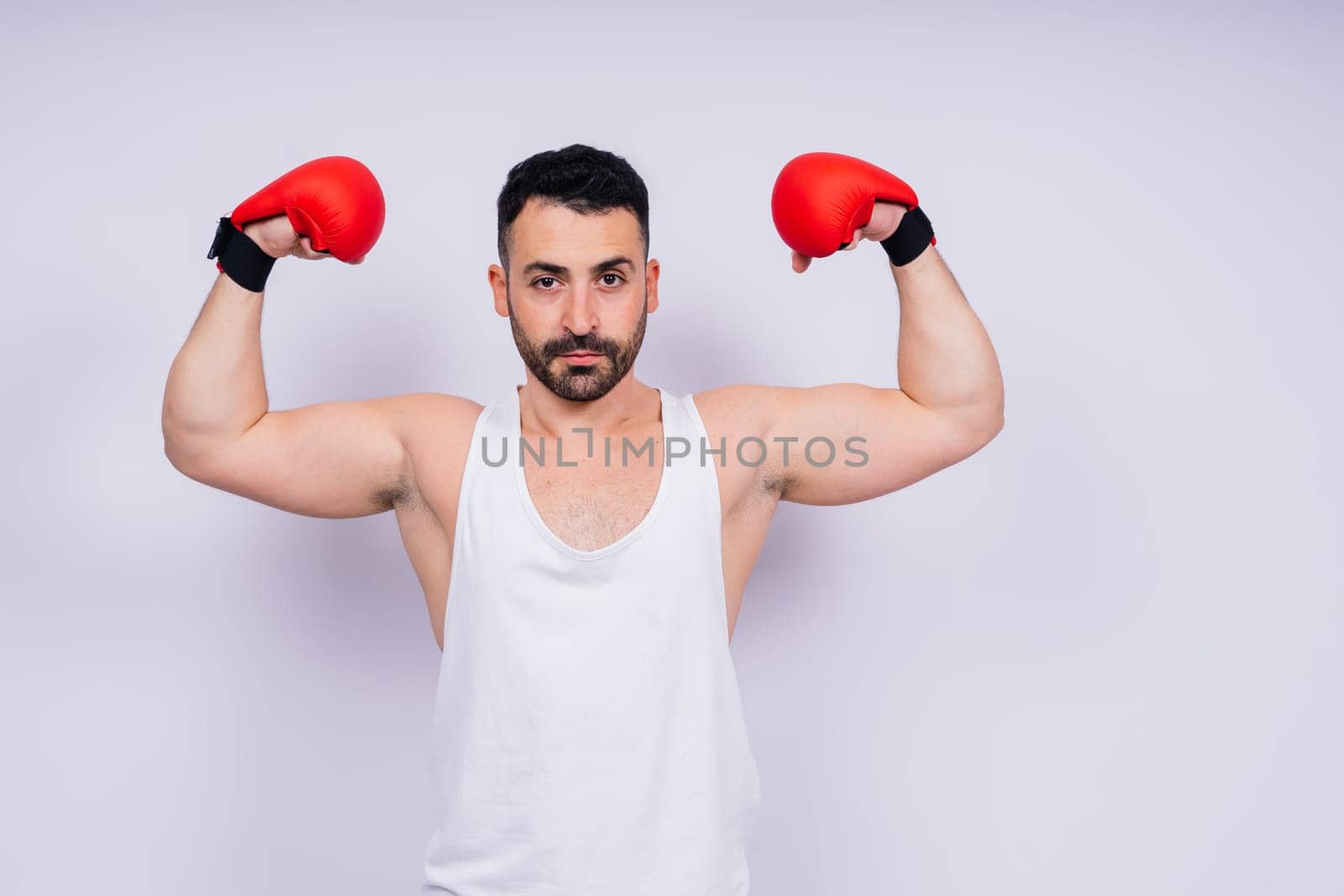 Young caucasian handsome man isolated on white background with boxing gloves by Zelenin