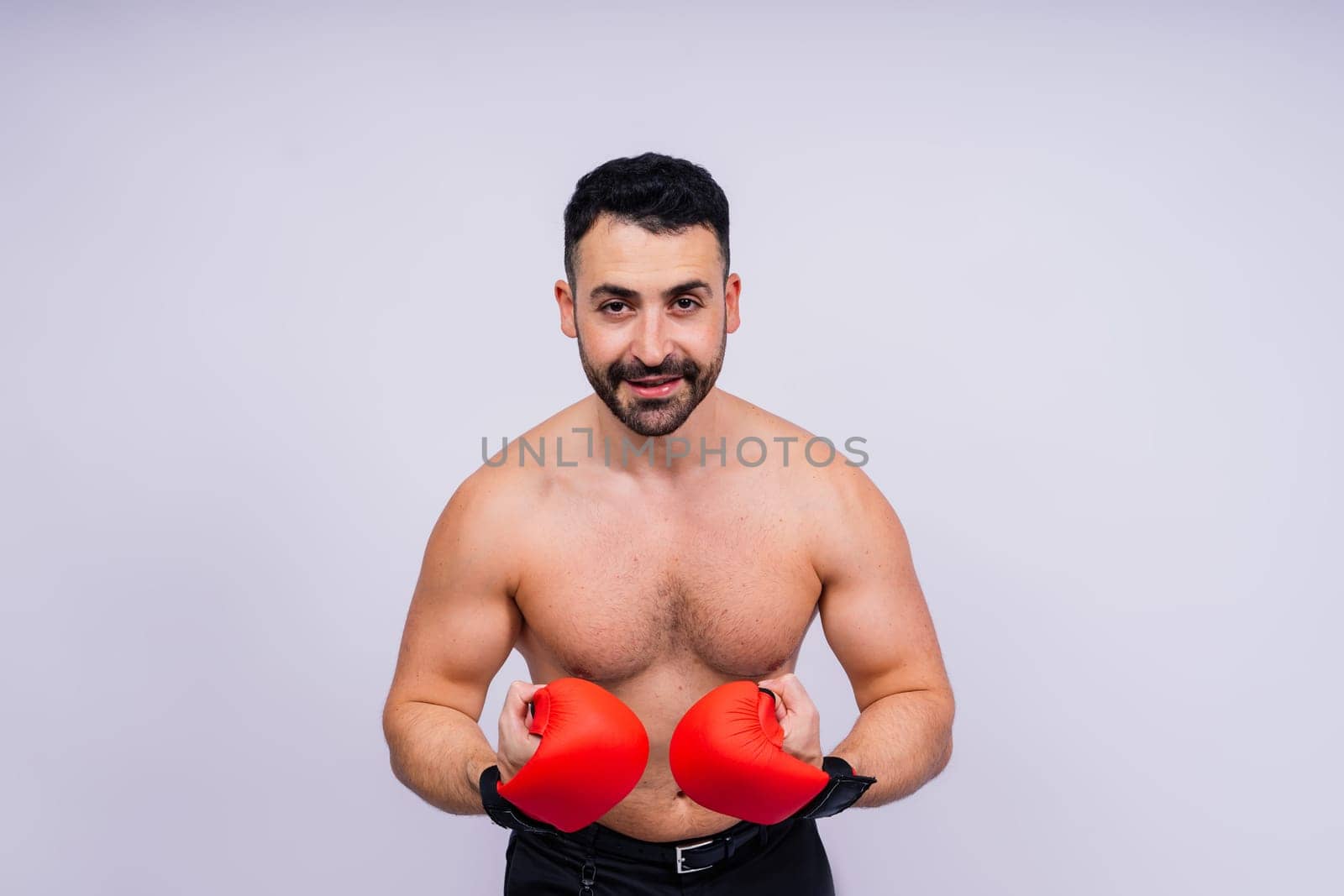 Young caucasian handsome man isolated on white background with boxing gloves by Zelenin