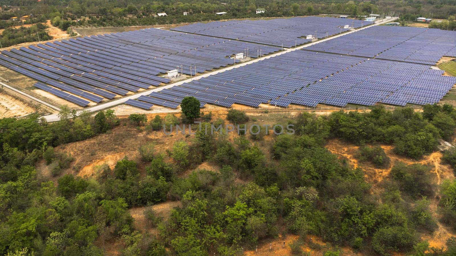 Top view on photovoltaic solar power panels. Drone aerial view of Solar panels system power generators from sun. Alternative Energy Sources - The Concept of Sustainable Resources.