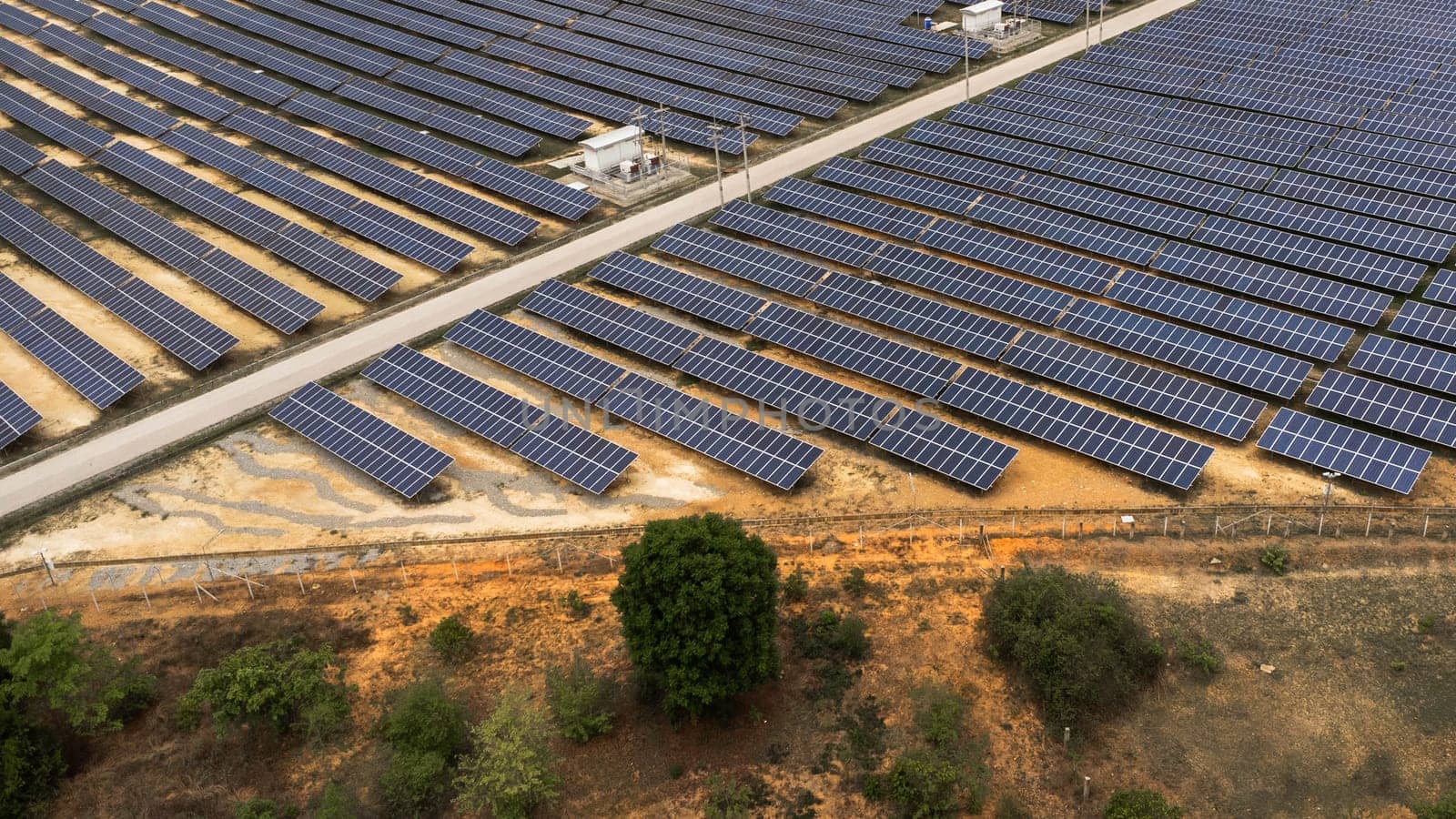 Top view on photovoltaic solar power panels. Drone aerial view of Solar panels system power generators from sun. Alternative Energy Sources - The Concept of Sustainable Resources. by TEERASAK