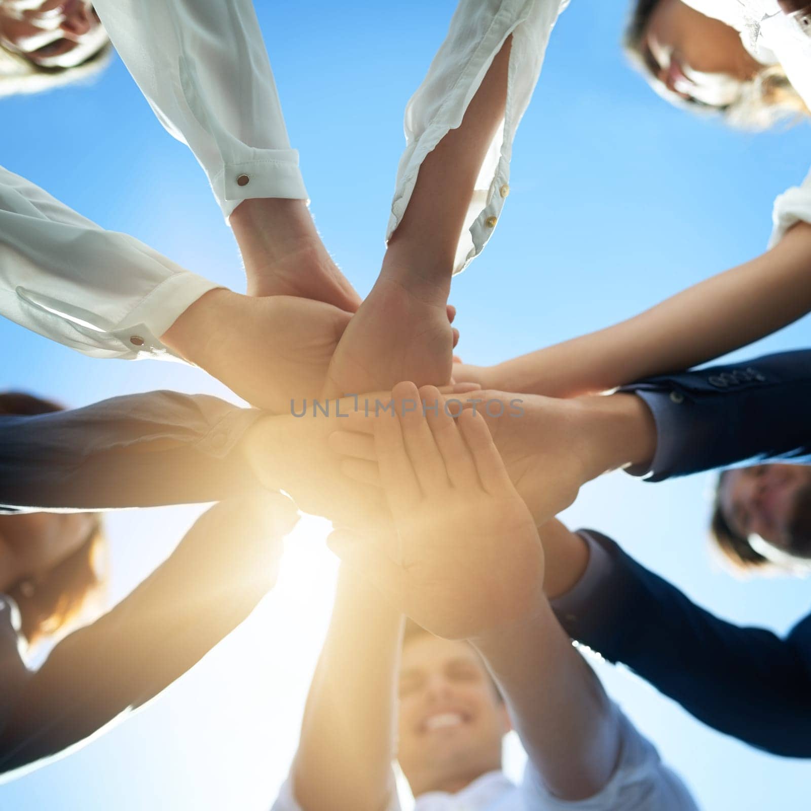 Hands together, trust and business people in team with low angle, support and solidarity with professional community. Diversity, collaboration and corporate group in meeting with goals and commitment by YuriArcurs