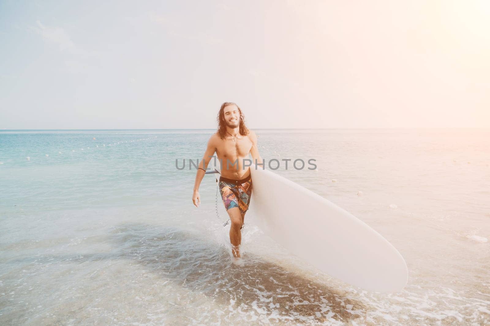 Asian man swimming in sea water and paddleboarding passing beautiful sea at summer sunset. Healthy strong male enjoy outdoor active lifestyle and water sports on holiday vacation