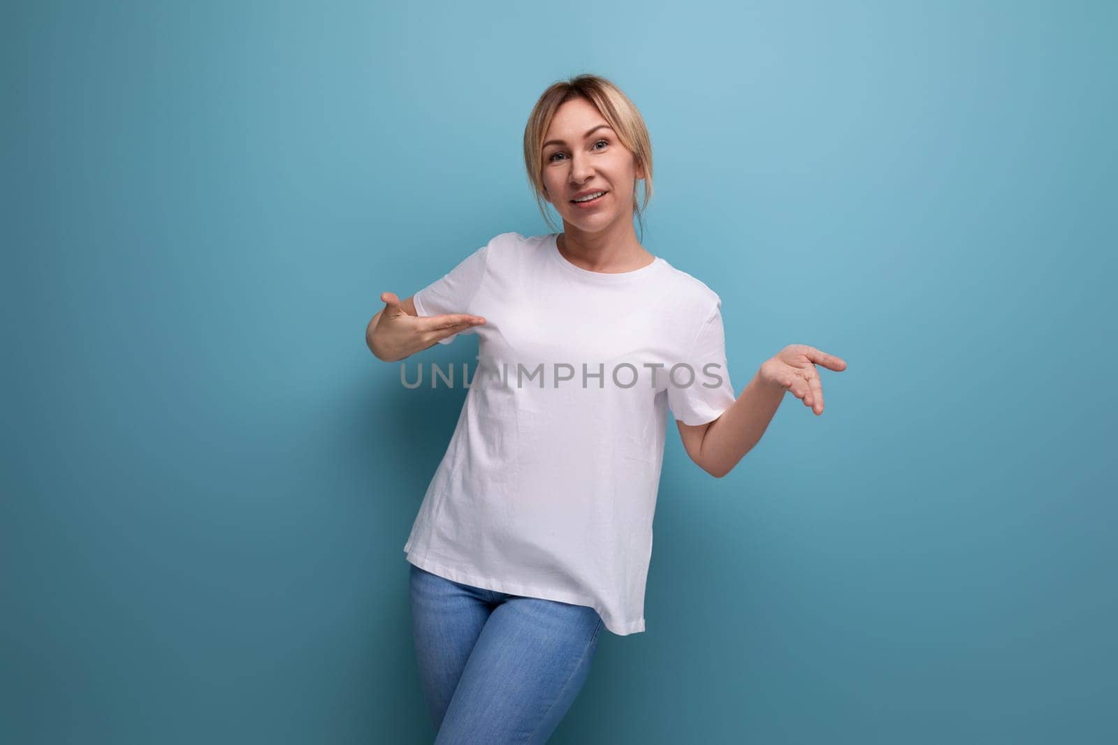 slim young woman dressed in a white tank top with a business mockup by TRMK
