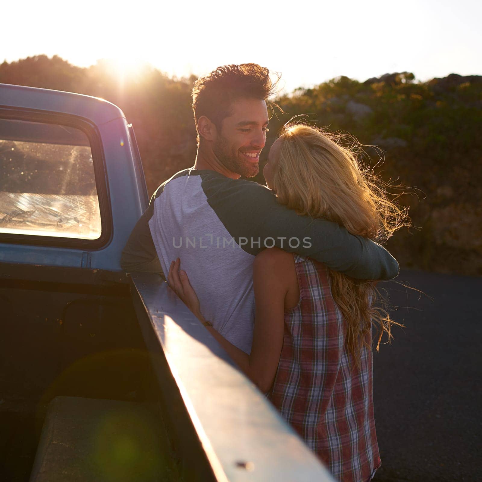 Hug, truck or happy couple on road trip in nature on romantic holiday vacation for bonding on date. Car, travel or people hugging to embrace on fun summer weekend break with romance in park together.