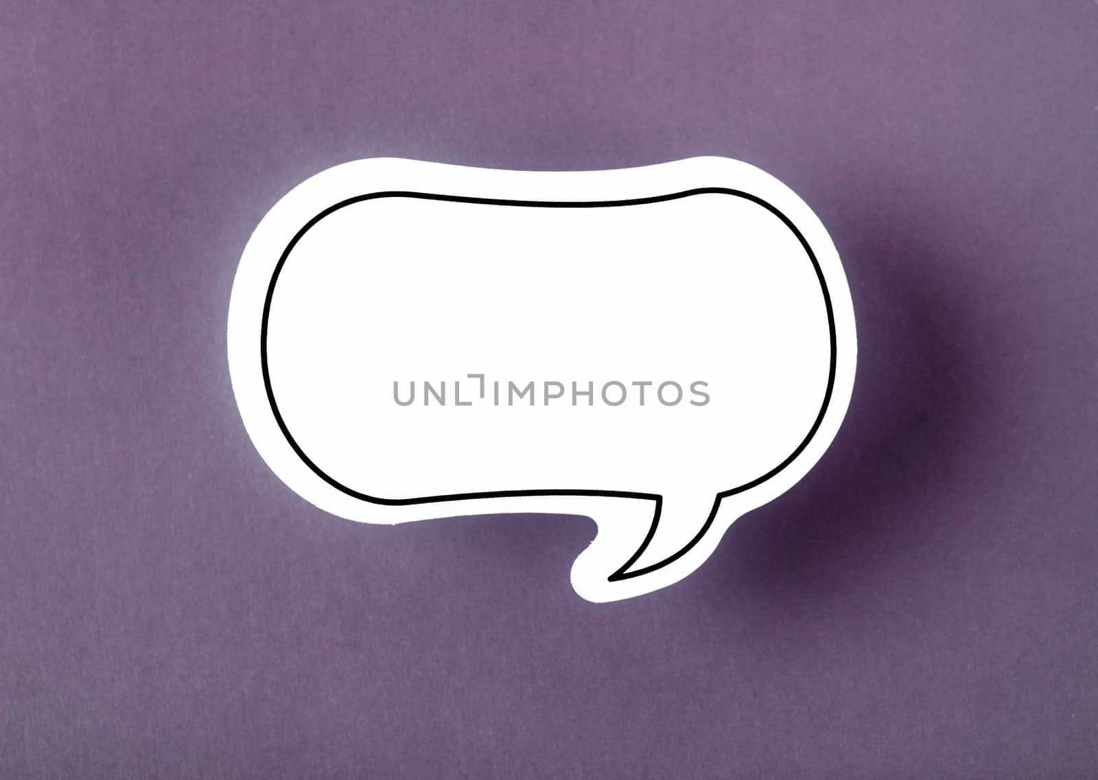 Speech bubble with copy space communication talking speaking concepts on purple background.