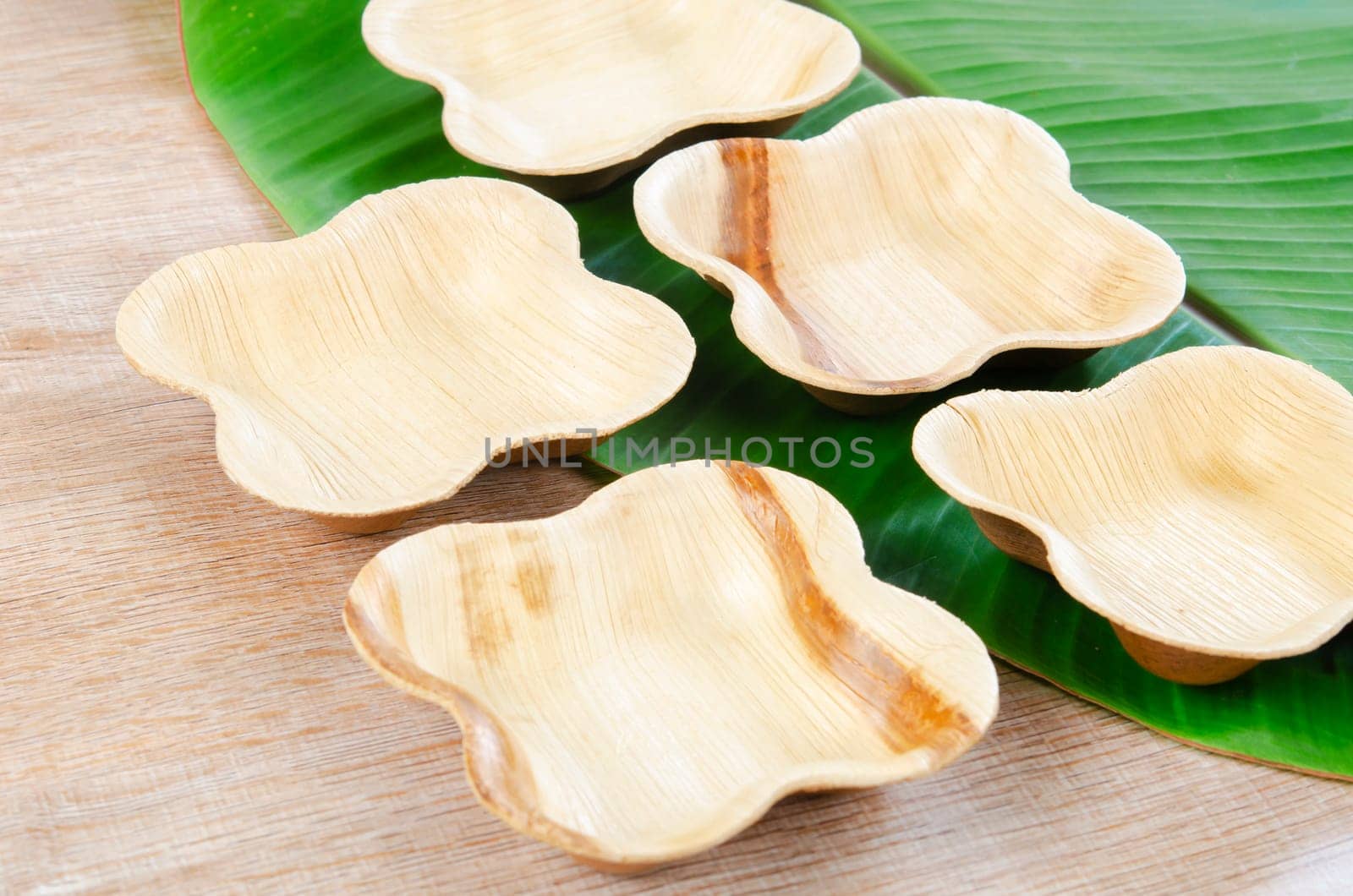 Kitchenware made from dried betel nut leaf palm, natural material. The Green product eco friendly concept.