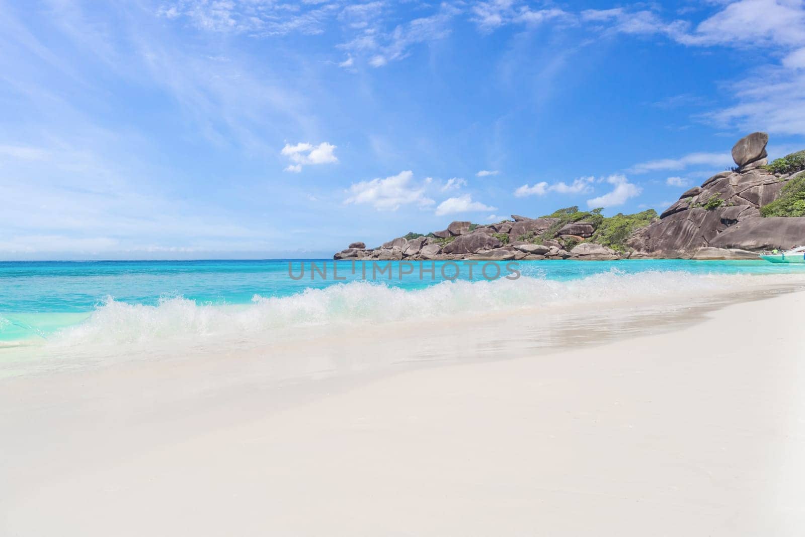 Beautiful sandy beach with wave crashing on sandy shore at Similan Islands Beautiful tropical sea Similan island No.4 at Similan national park, Phang nga Thailand