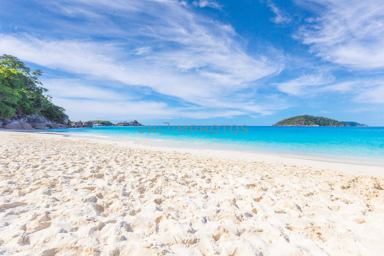 Beautiful sandy beach with wave crashing on sandy shore at Similan Islands Beautiful tropical sea Similan island No.4 at Similan national park, Phang nga Thailand