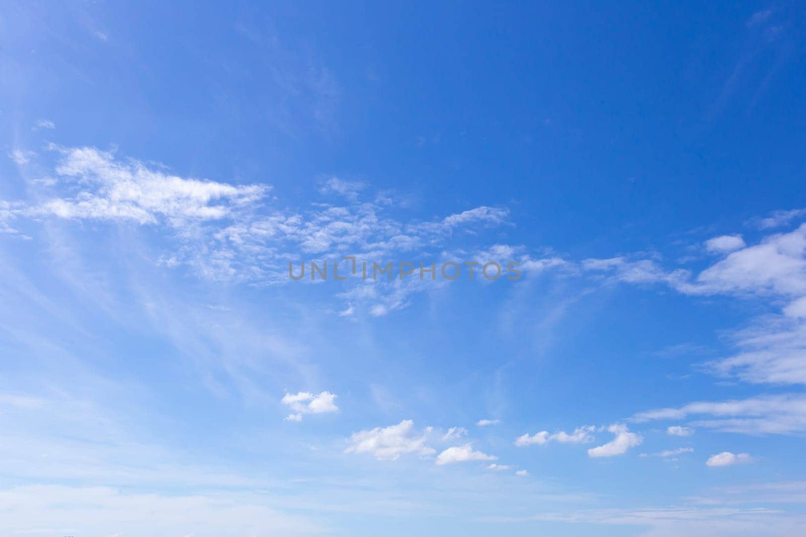 The Blue sky with scattered clouds by Gamjai