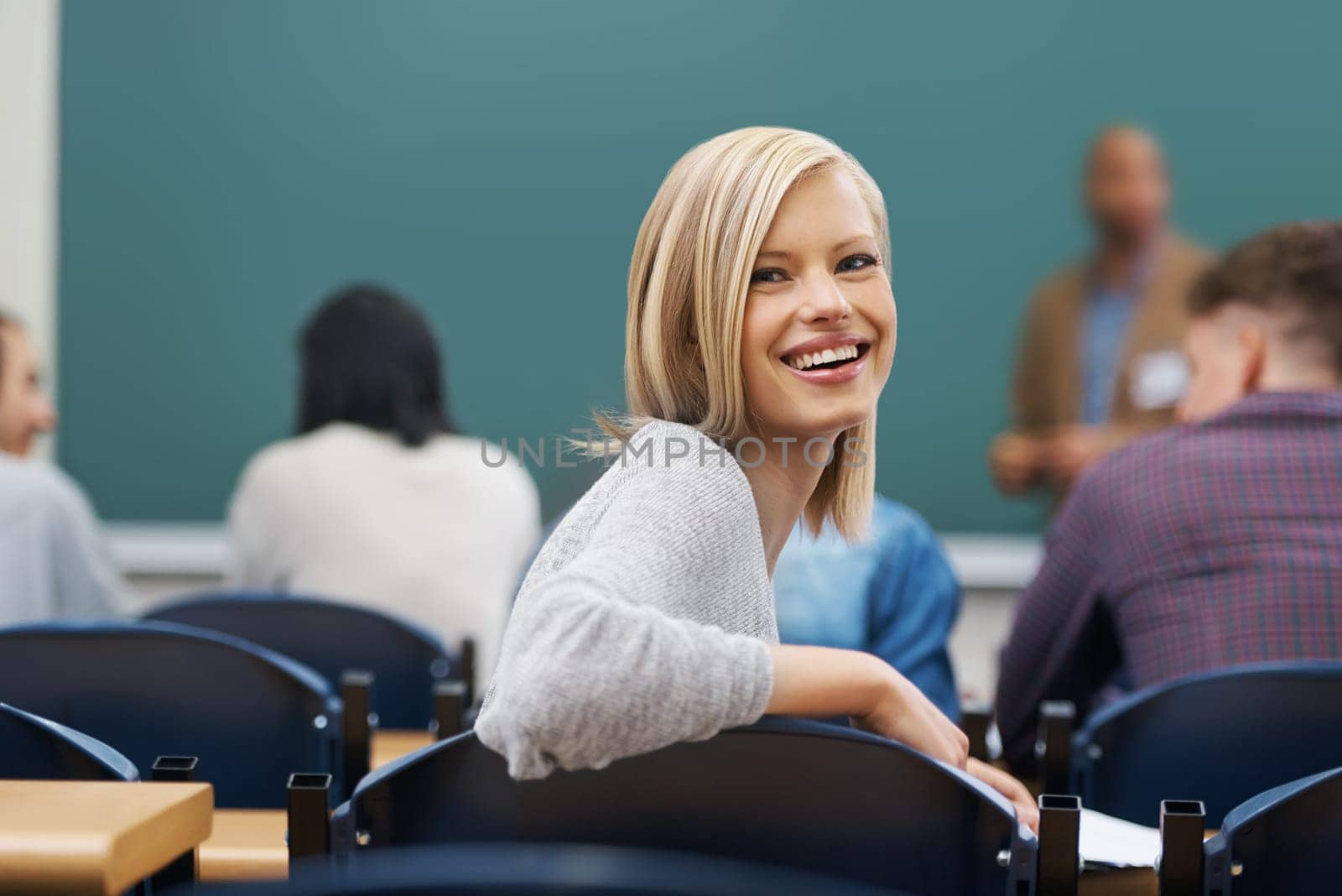 Her education is important to her. Portrait of a university student in a lecture hall