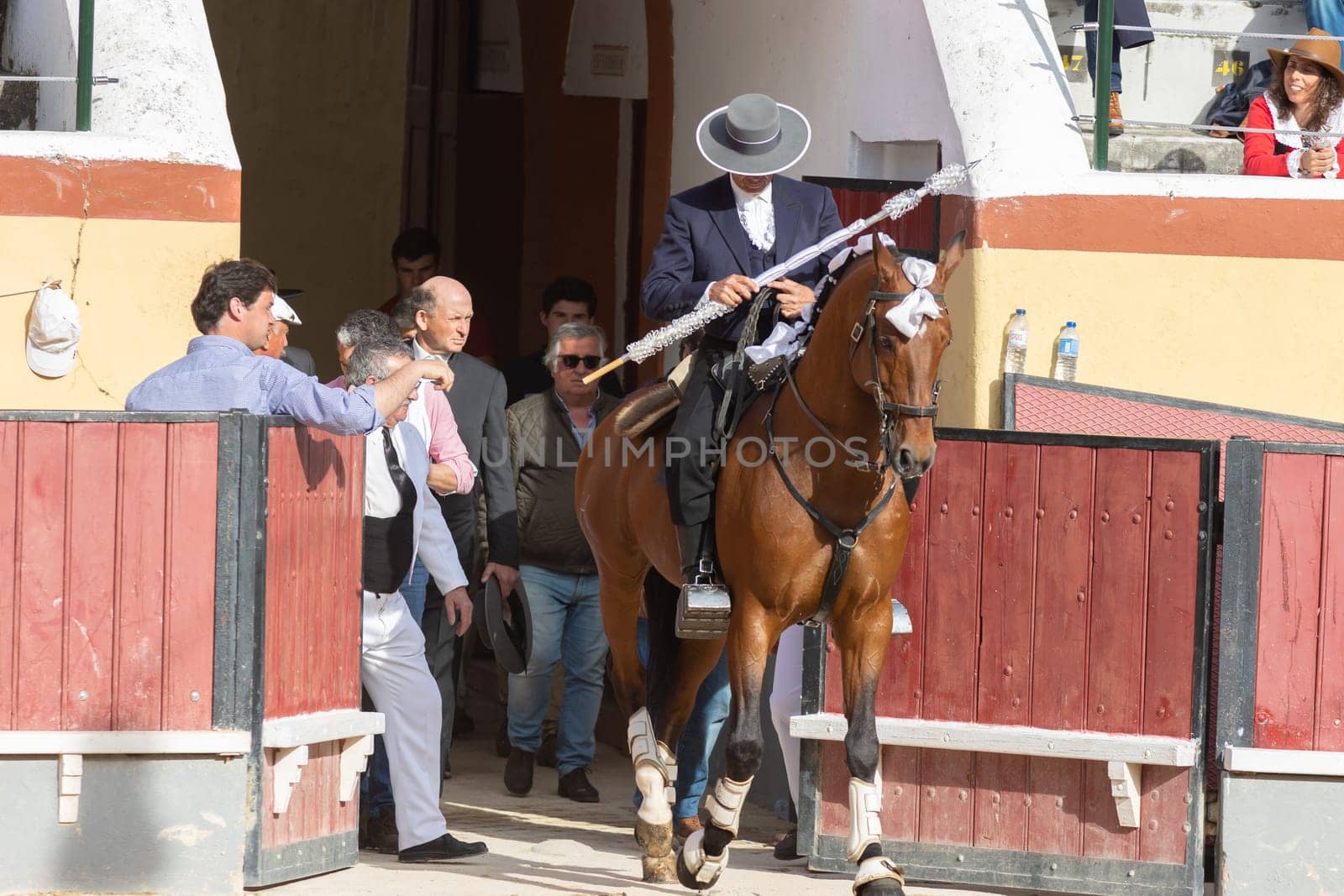 March 26, 2023 Lisbon, Portugal: Tourada - cavaleiro on horseback comes out of the paddock into the arena holding spear by Studia72