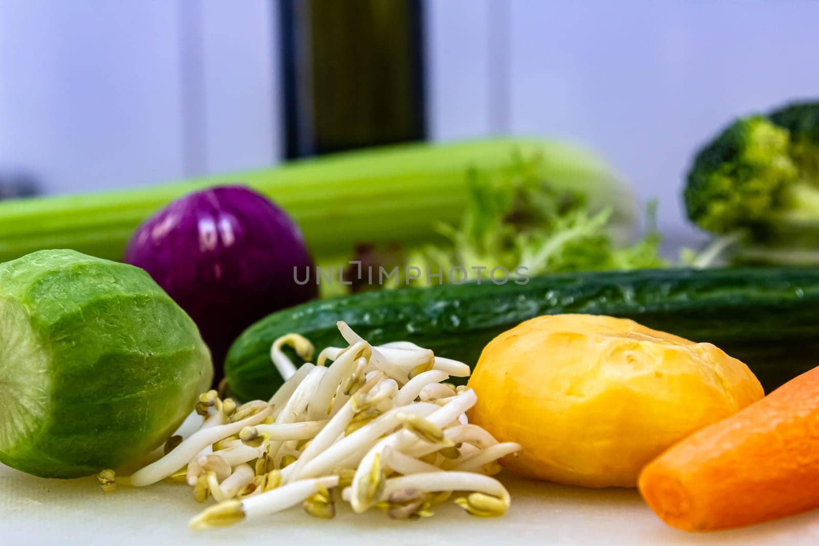 Vegan protein food background. soy sprouts carrots, potatoes, vegetables lie on the board prepared for salad preparation by Milanchikov