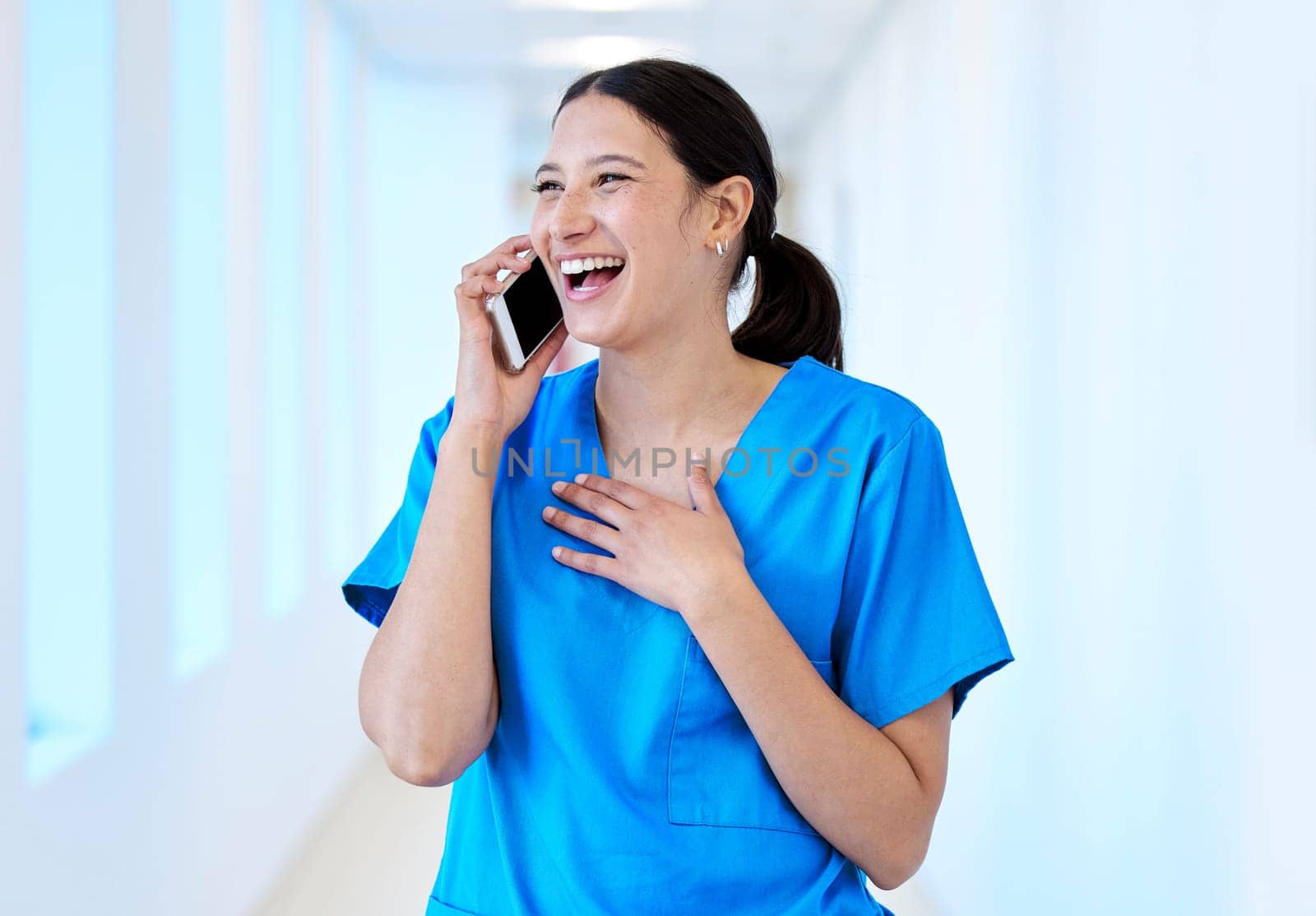 Its so good to hear your voice. a young dental assistant using her smartphone to make a call
