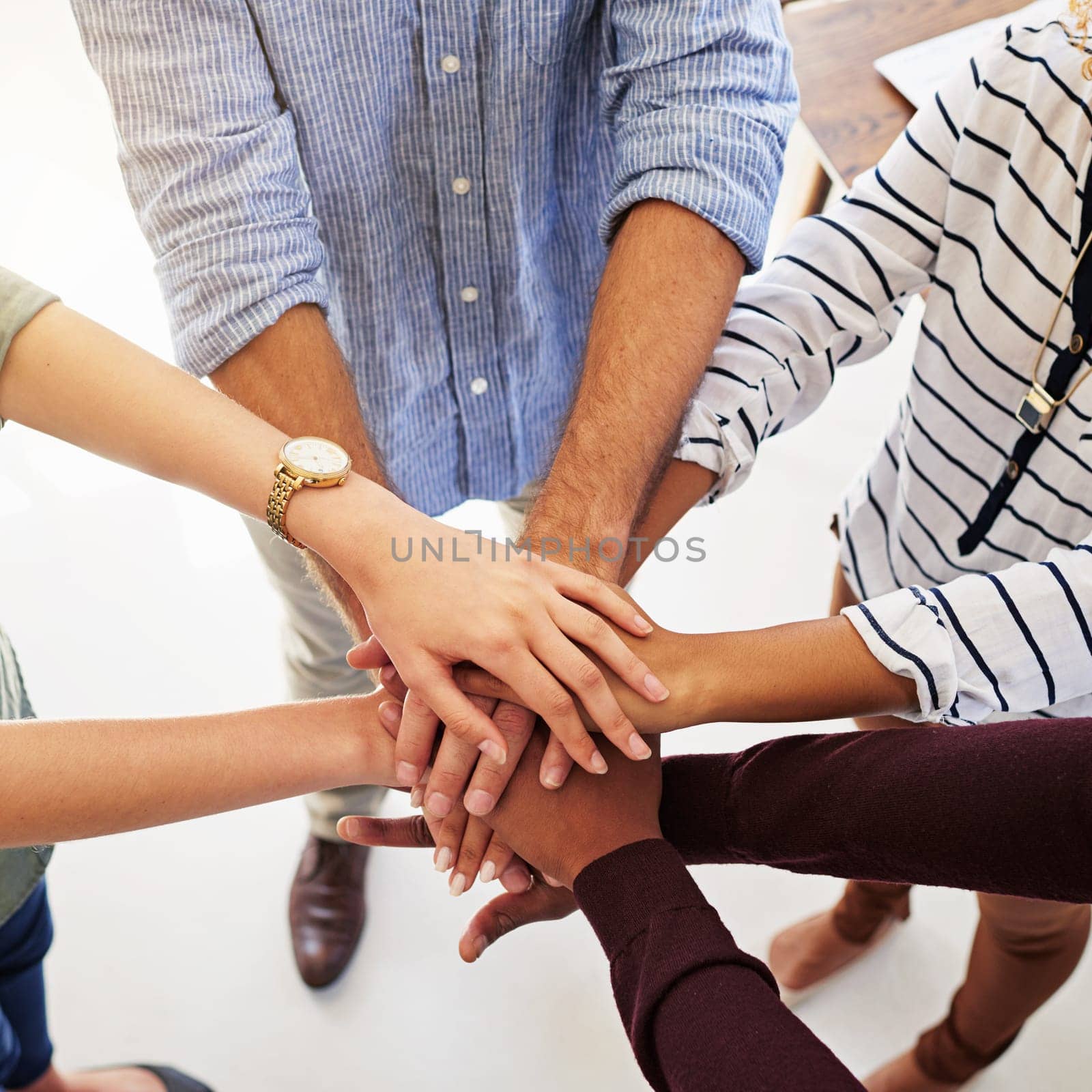 Business people, hands and unity in collaboration for teamwork, goal or diversity above at the workplace. Hand of group piling in team trust for community, motivation or agreement together.