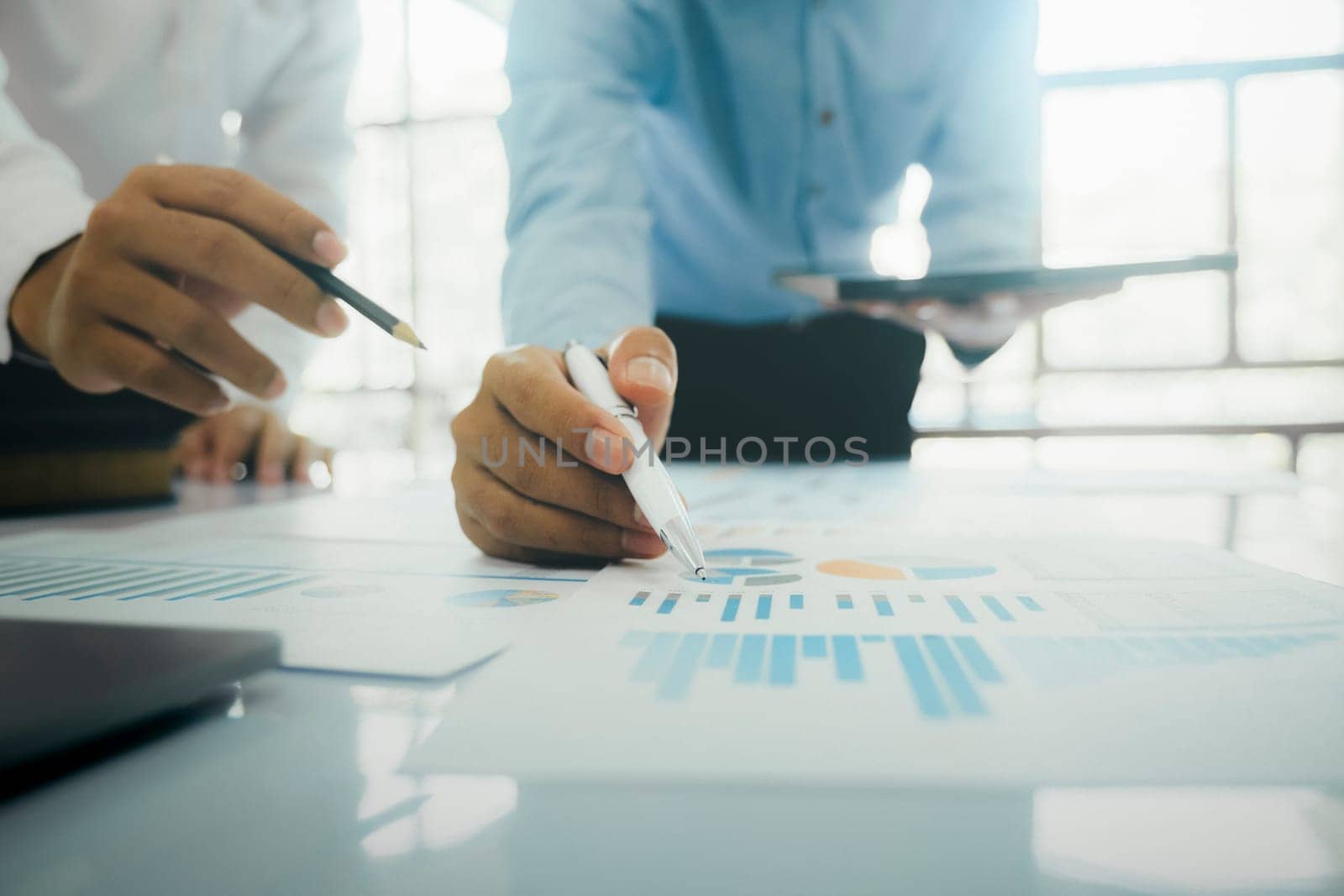 Startup asian business teamwork analyse investment marketing data on computer laptop and use calculator ,finance meeting.