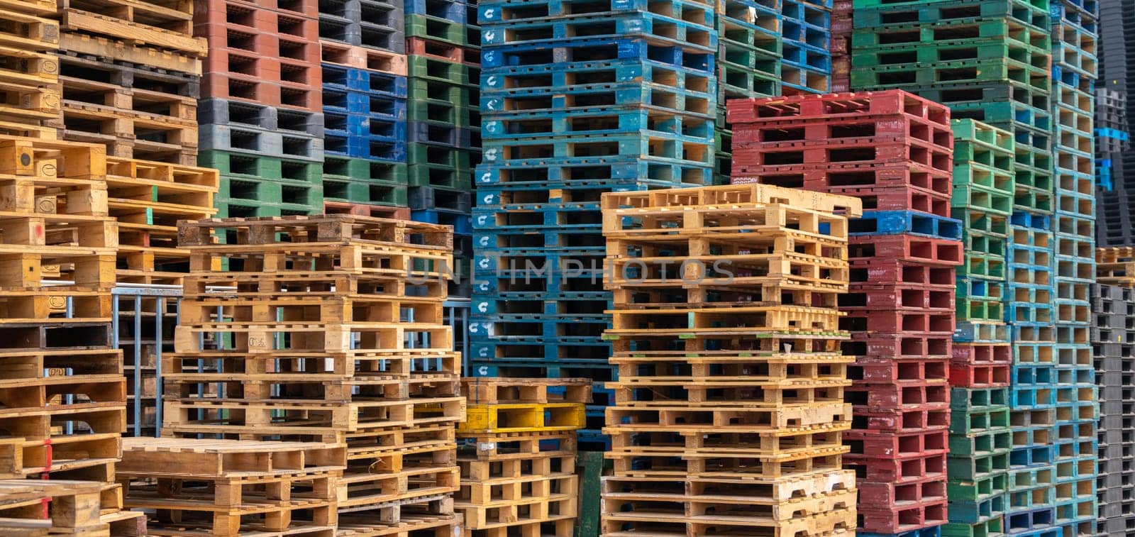 Stack of wooden pallet. Industrial wood pallet at factory warehouse. Cargo and shipping concept. Sustainability of supply chains. Eco-friendly nature and sustainable properties. Renewable wood pallet. by Fahroni