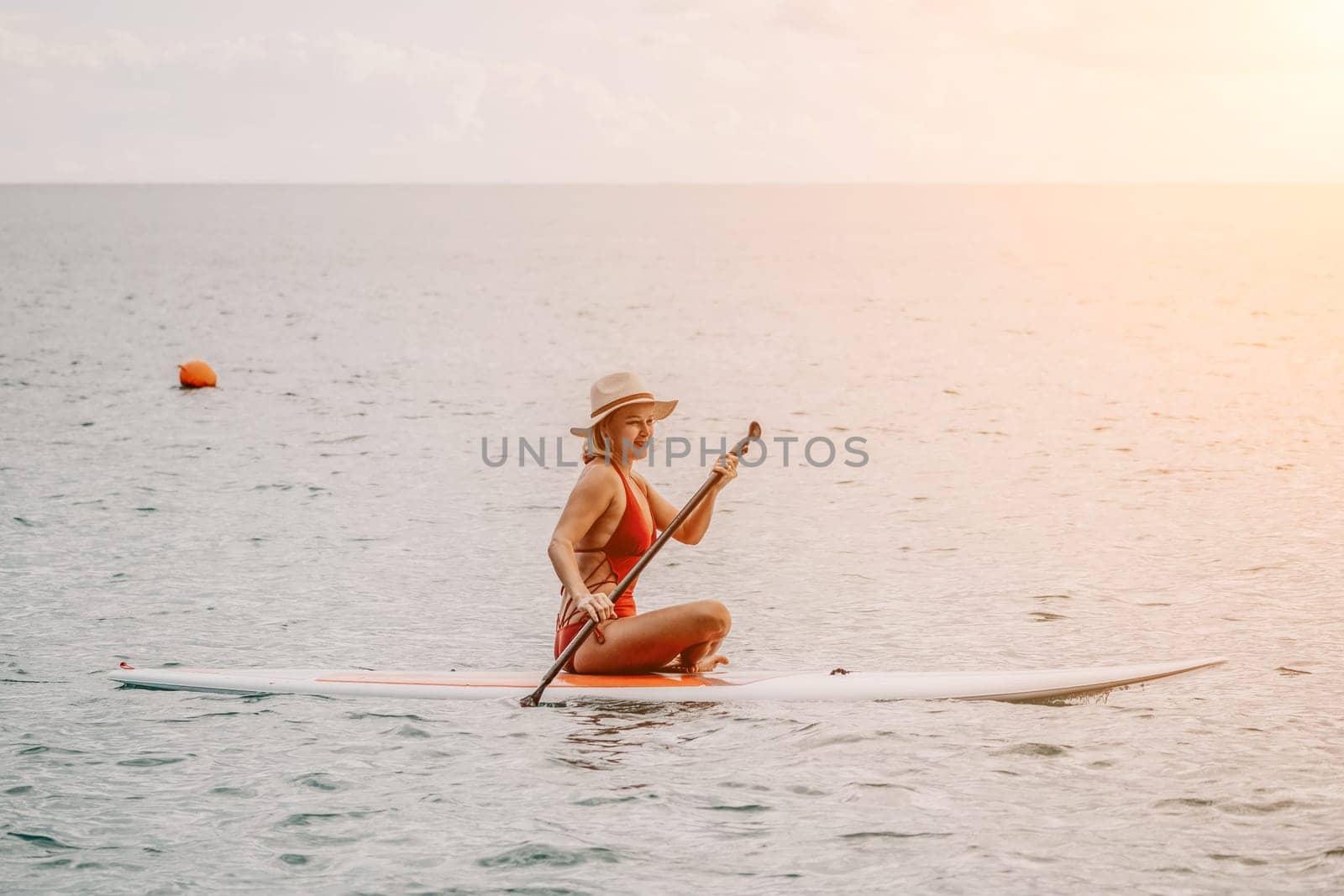 young woman in stylish bikini lying on seashore, closeup. Holiday, vacation and recreational concept.