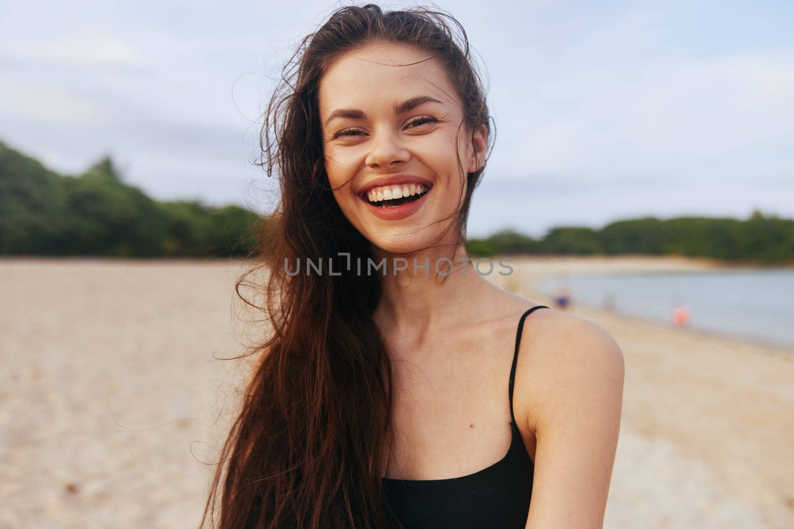 woman sea caucasian happiness lifestyle beach walking vacation space happy girl smile outdoor sand smiling water copy free ocean sunlight sunset summer