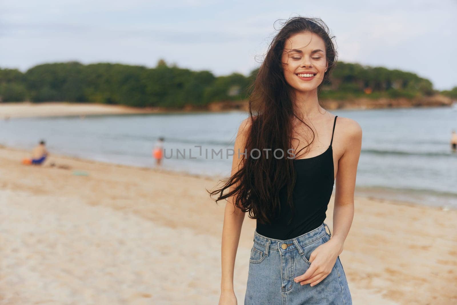 woman ocean sea vacation sand smile summer beach sunset outdoor lifestyle by SHOTPRIME