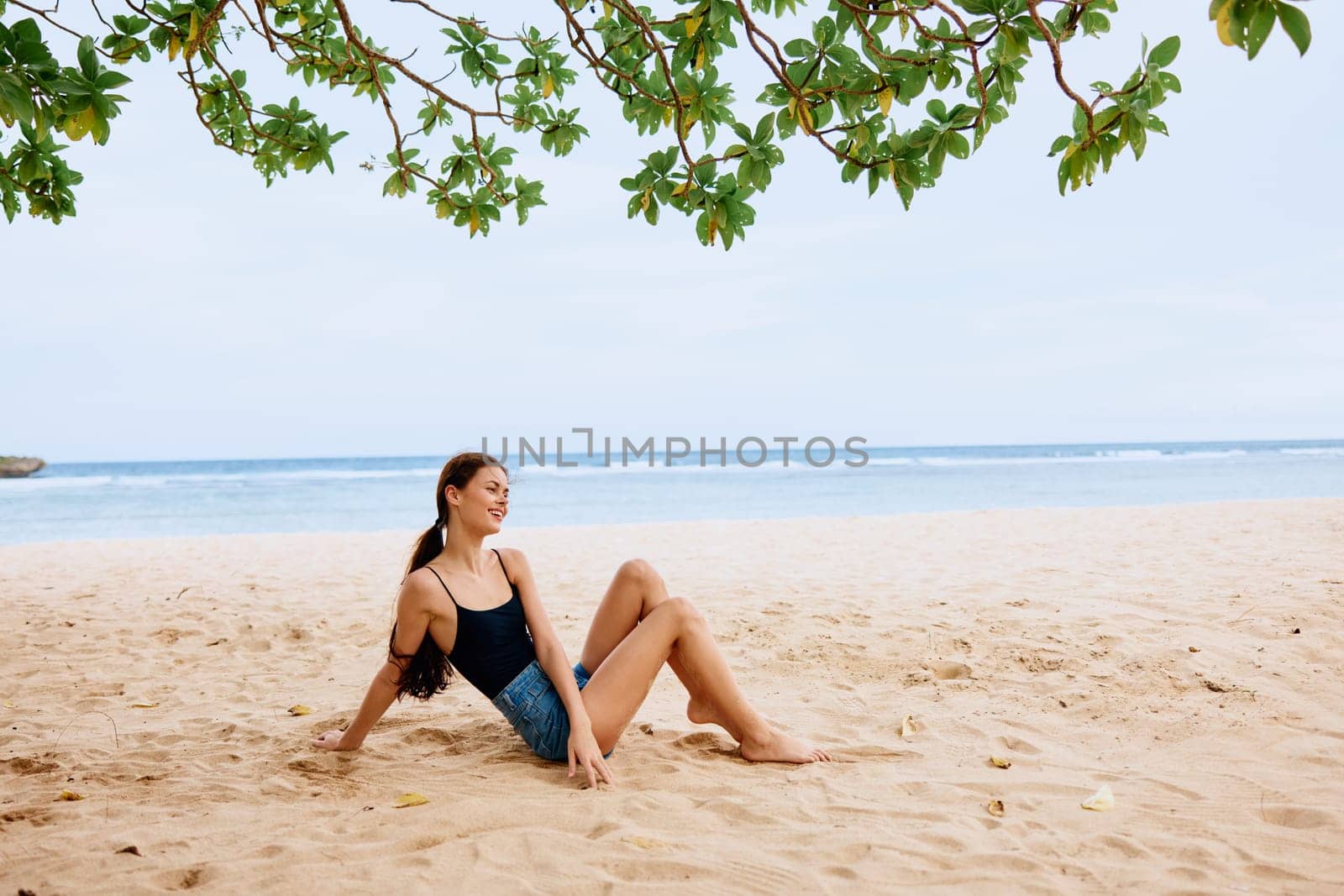 sea woman beach vacation travel sand sitting water smile nature freedom by SHOTPRIME