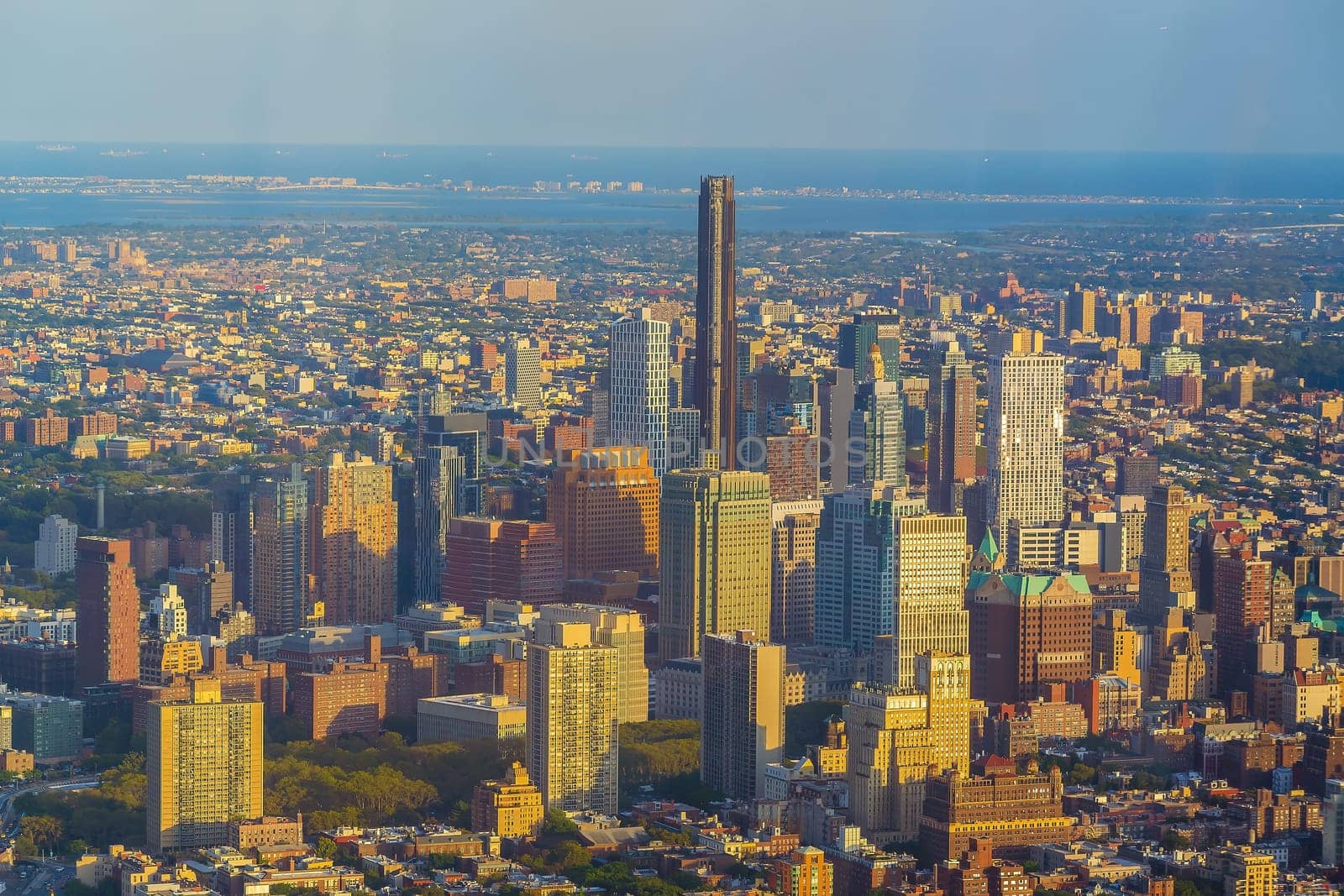 Cityscape of downtown Brooklyn skyline  from Manhattan New York City at sunset  