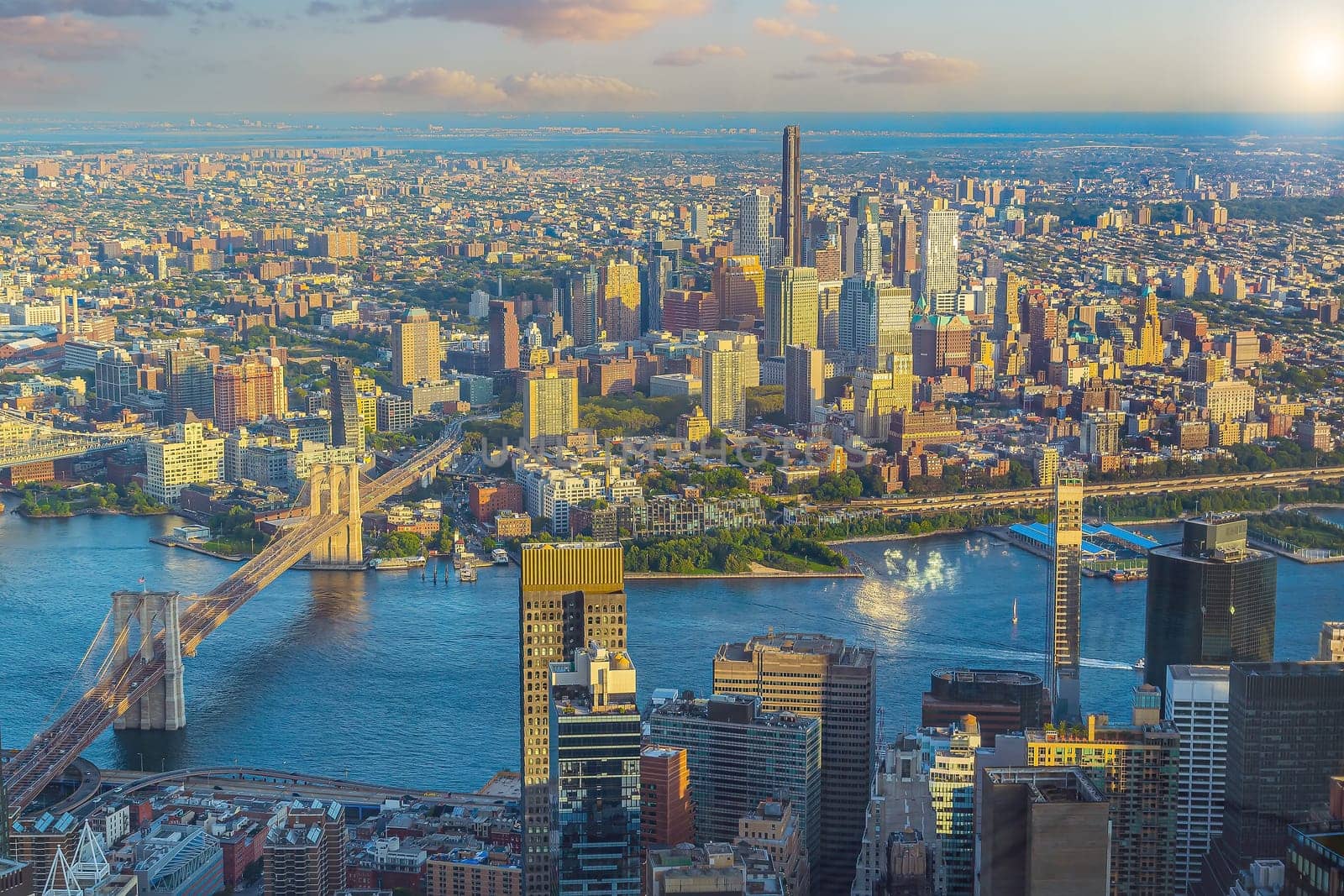 Cityscape of downtown Brooklyn skyline  from Manhattan New York City at sunset  