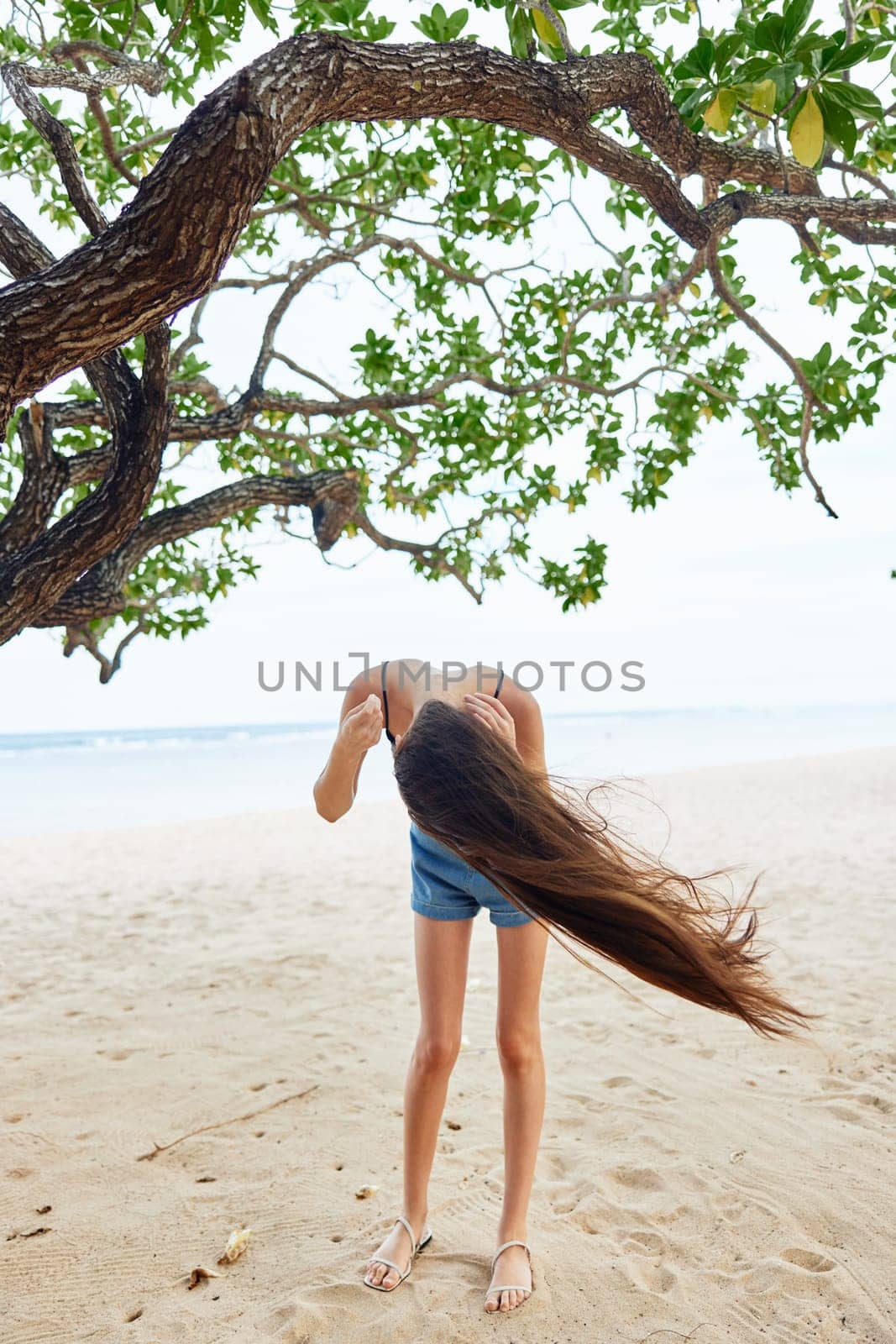 woman lifestyle relax happy tree nature vacation hanging sky sea smiling by SHOTPRIME