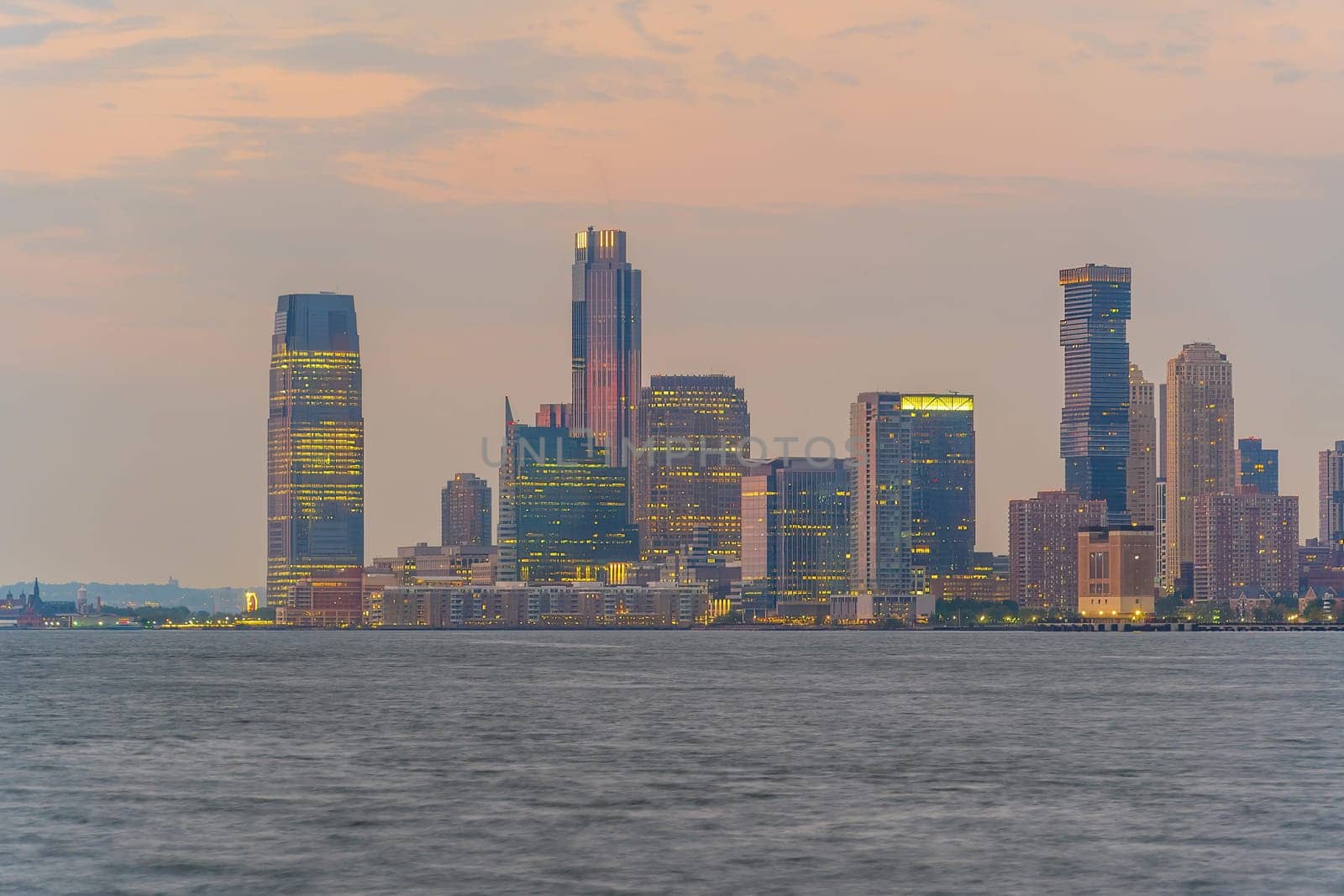 Cityscape of Jersey City skyline  from Manhattan New York City at sunset  
