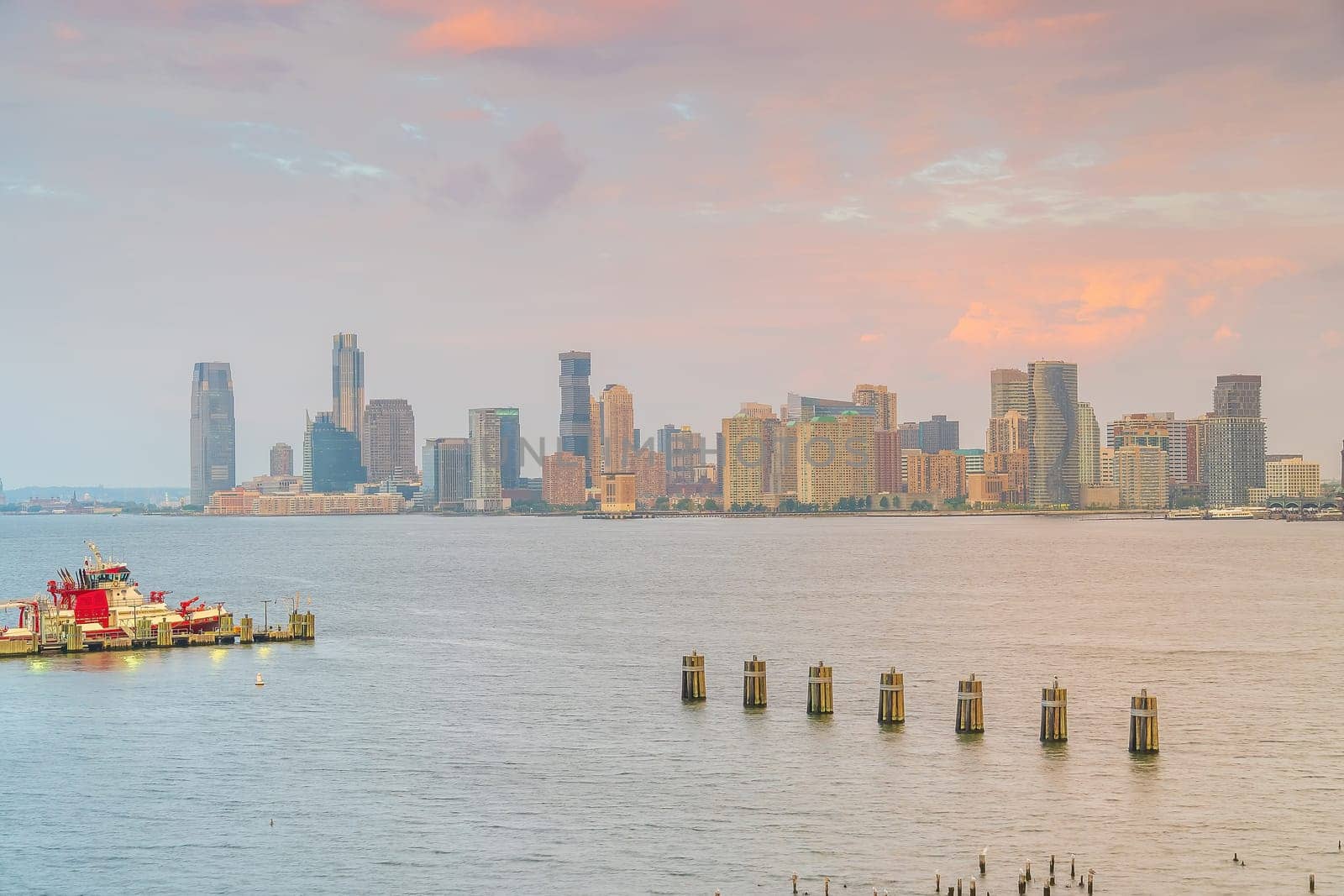 Cityscape of Jersey City skyline  from Manhattan New York City at sunset  