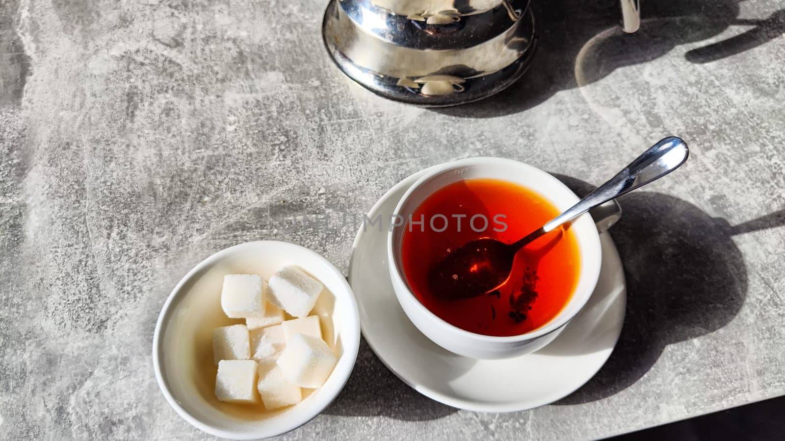 Black tea in porcelain white cup on the table in vintage place. Tea ceremony