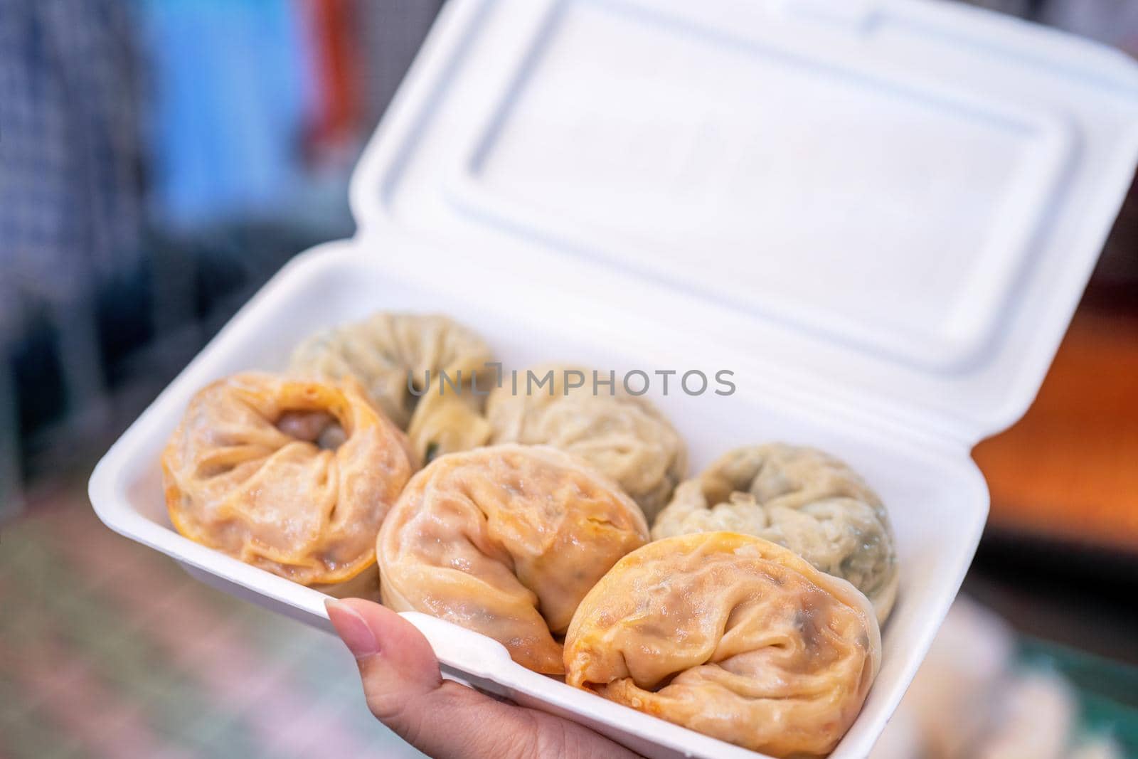 Delicious steamed round shaped dumplings in South Korea traditional market, special korean street food cuisine, close up, bokeh, copy space