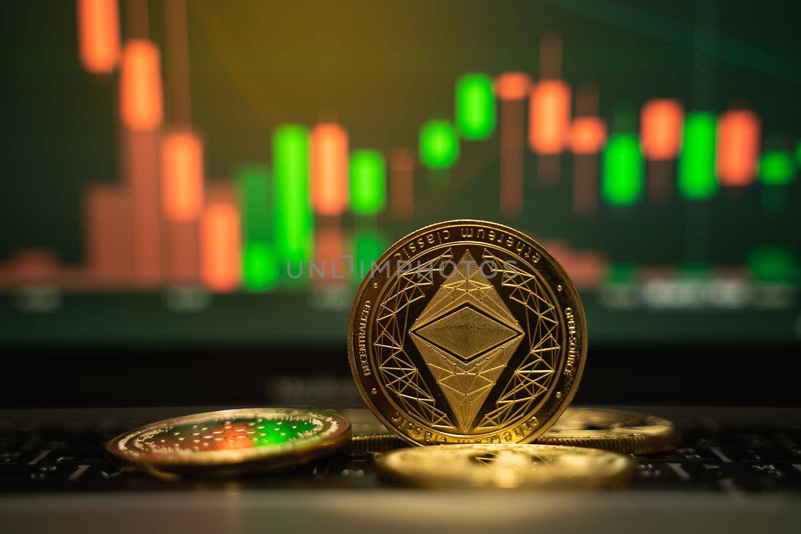 Ethereum gold coin and defocused chart background, cryptocurrency concept by Wmpix