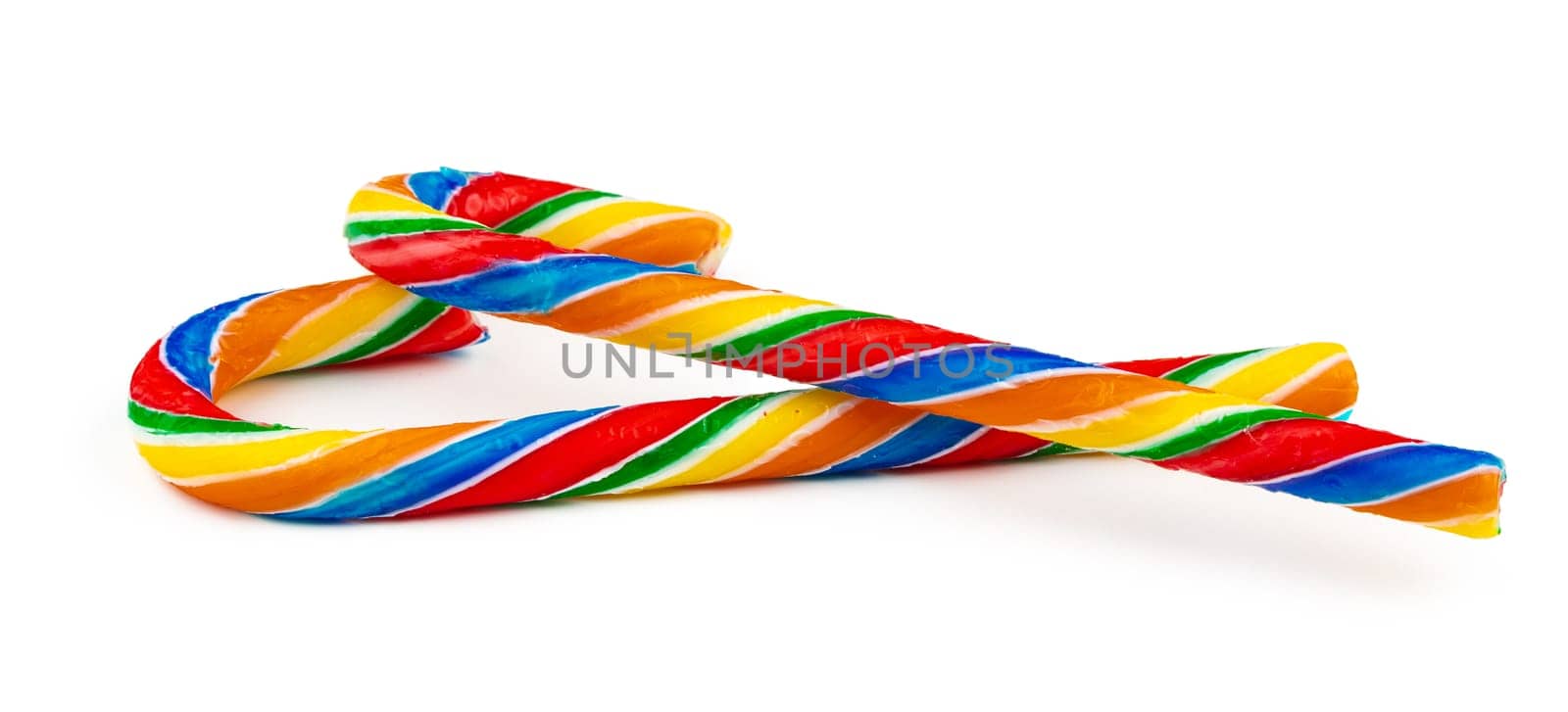 Rainbow colored candy cane isolated on white background