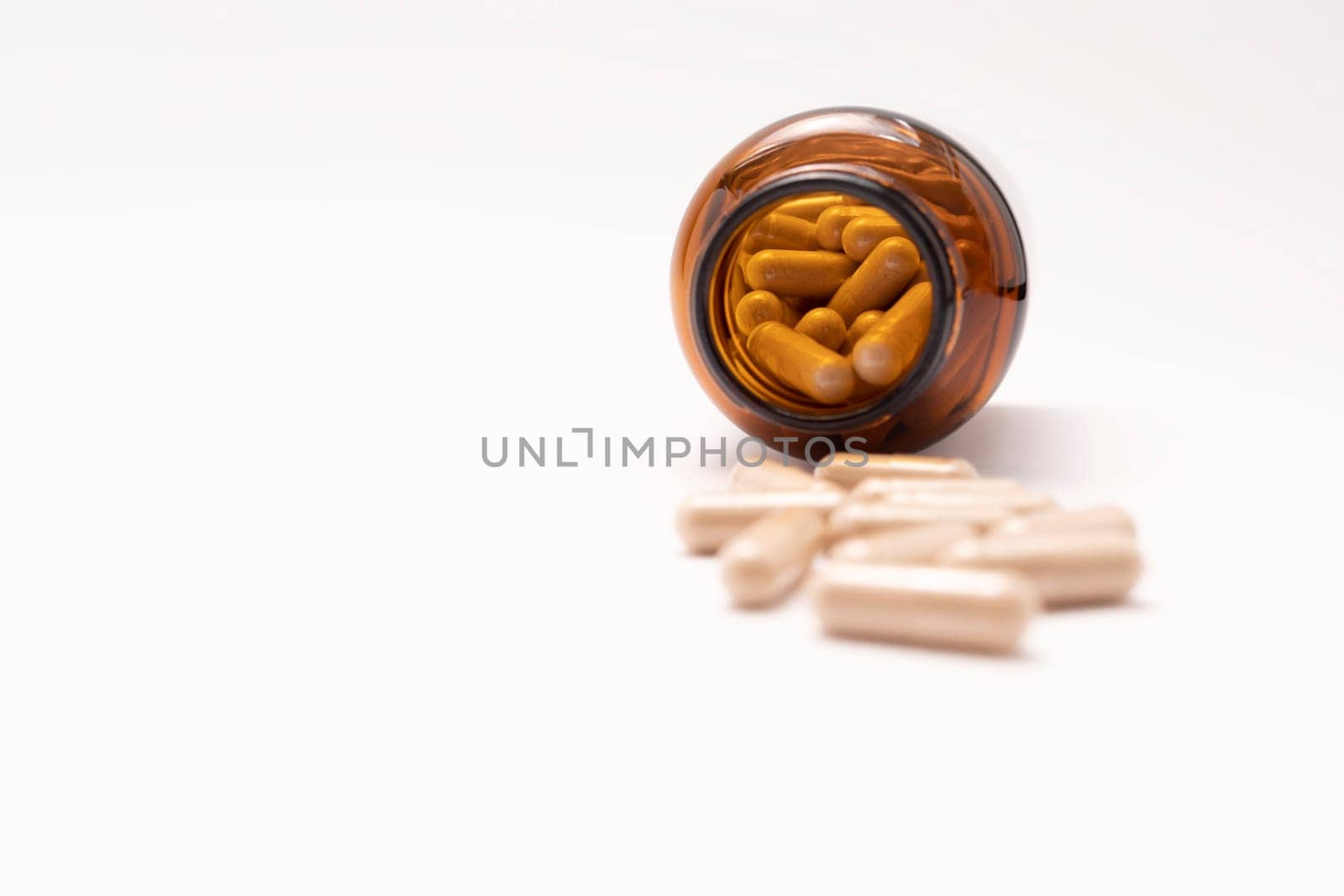 Softgel Capsules OF Slippery Elm, Brown Glass Bottle On White Background, Copy Space for Text. Herbal Supplement, Medication. Ulmus Fulva, Natural Remedy Concept. Horizontal plane.