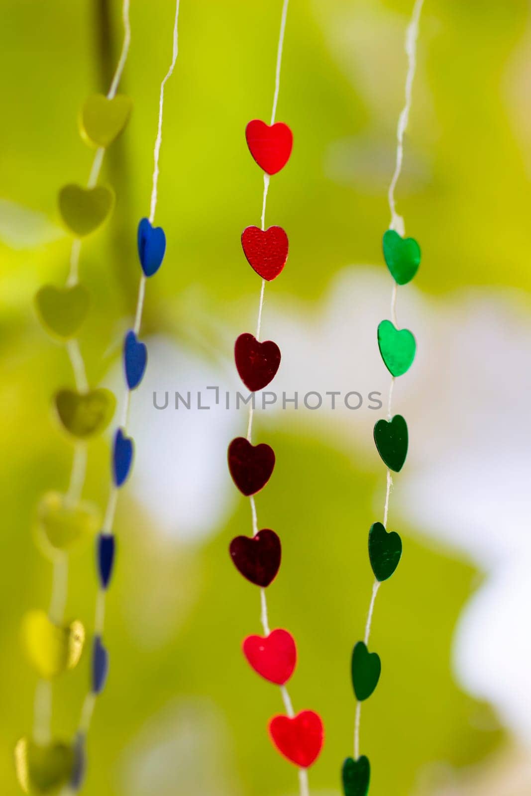 Colored shiny hearts hanging garland for Valentine's Day