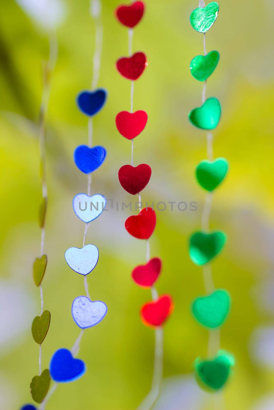 Colored shiny hearts hanging garland for Valentine's Day