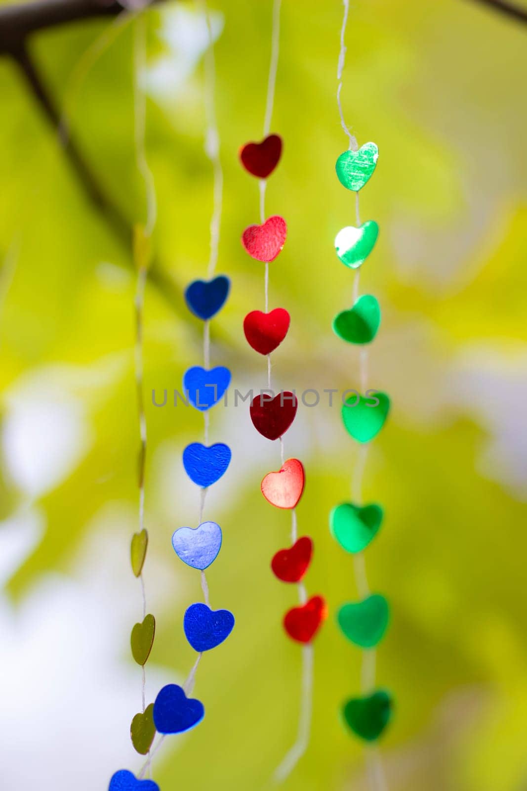 Colored shiny hearts hanging garland for Valentine's Day