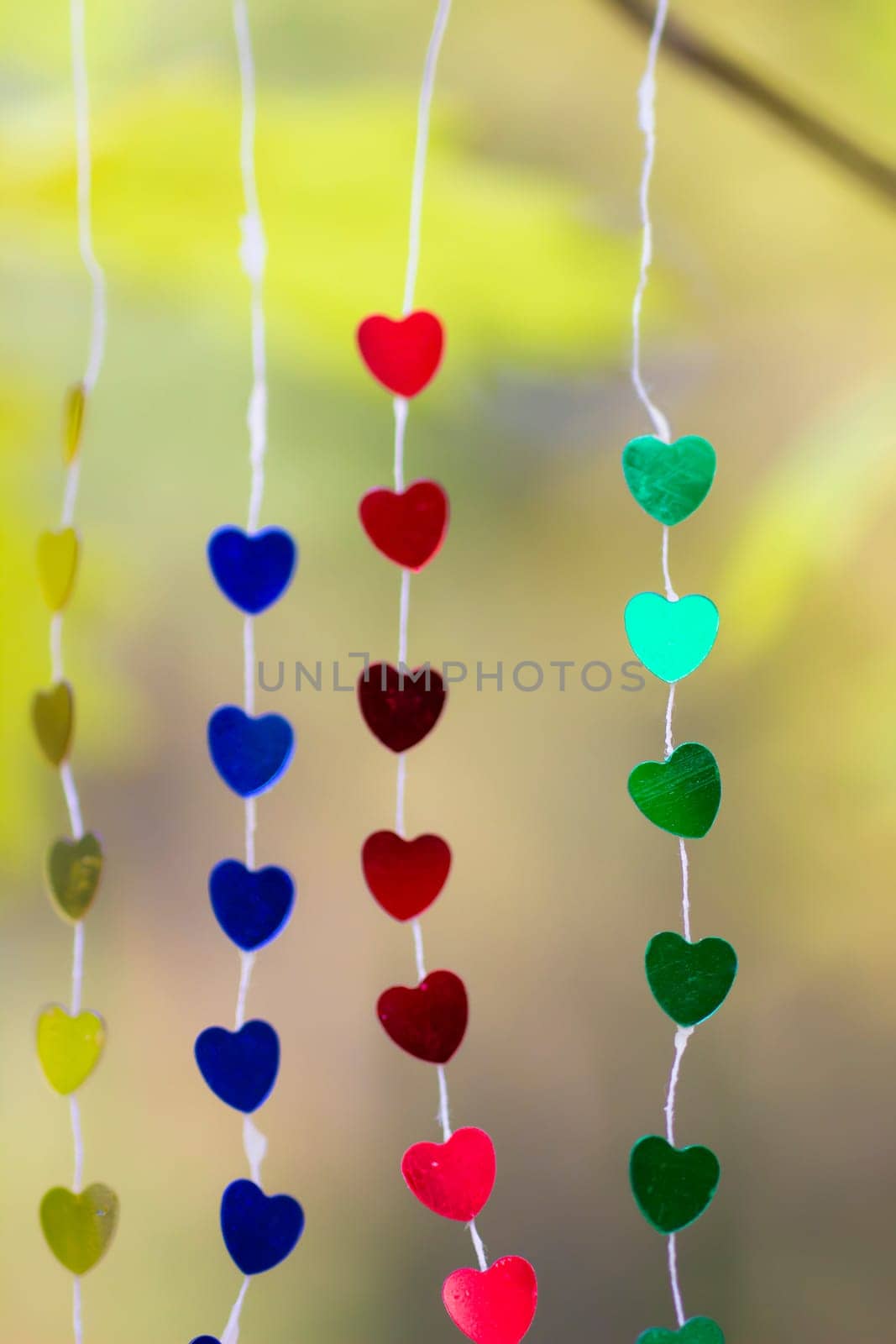 Colored hearts hanging garland for Valentine's Day by lanart