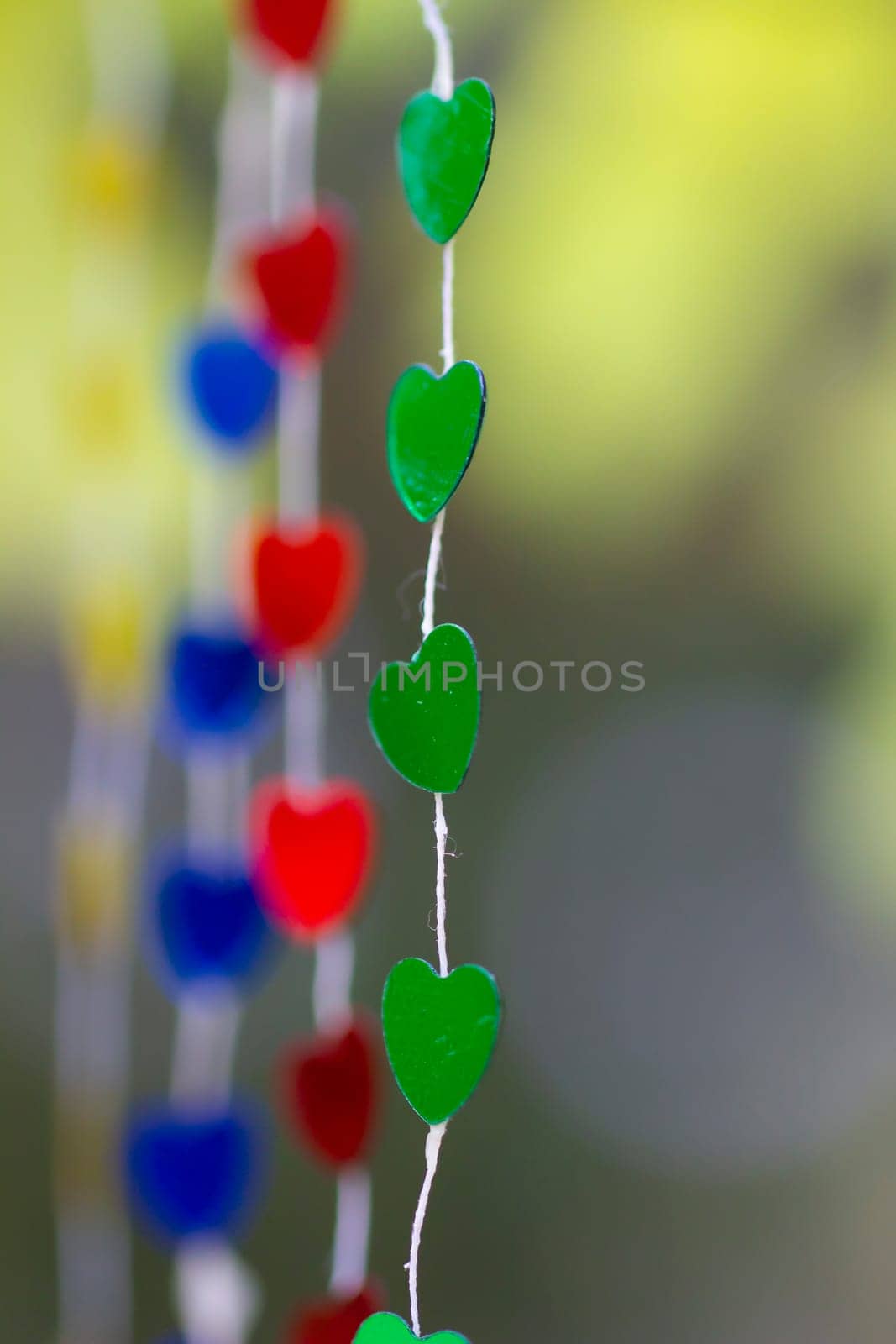 Colored shiny hearts hanging garland for Valentine's Day