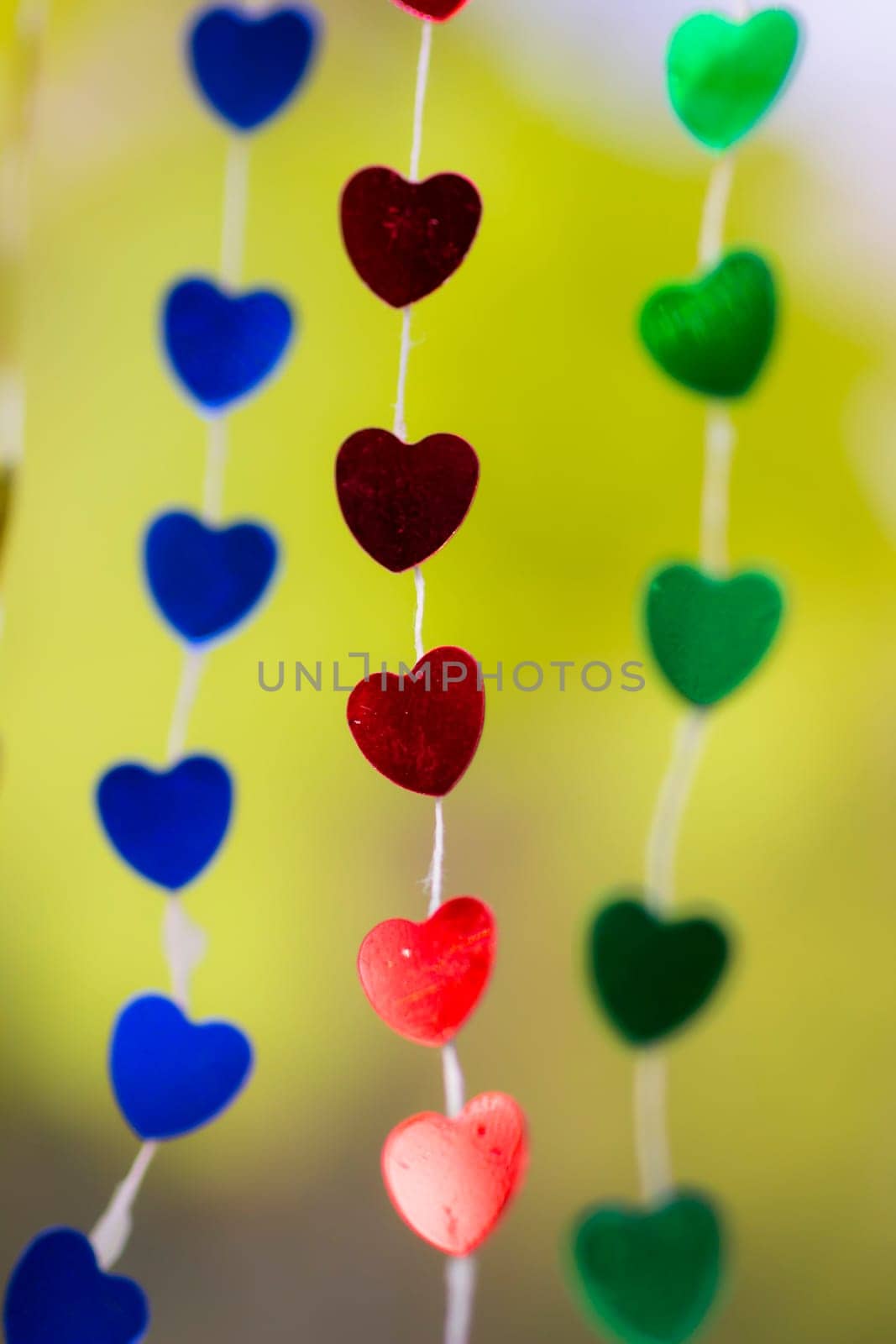 Colored shiny hearts hanging garland for Valentine's Day