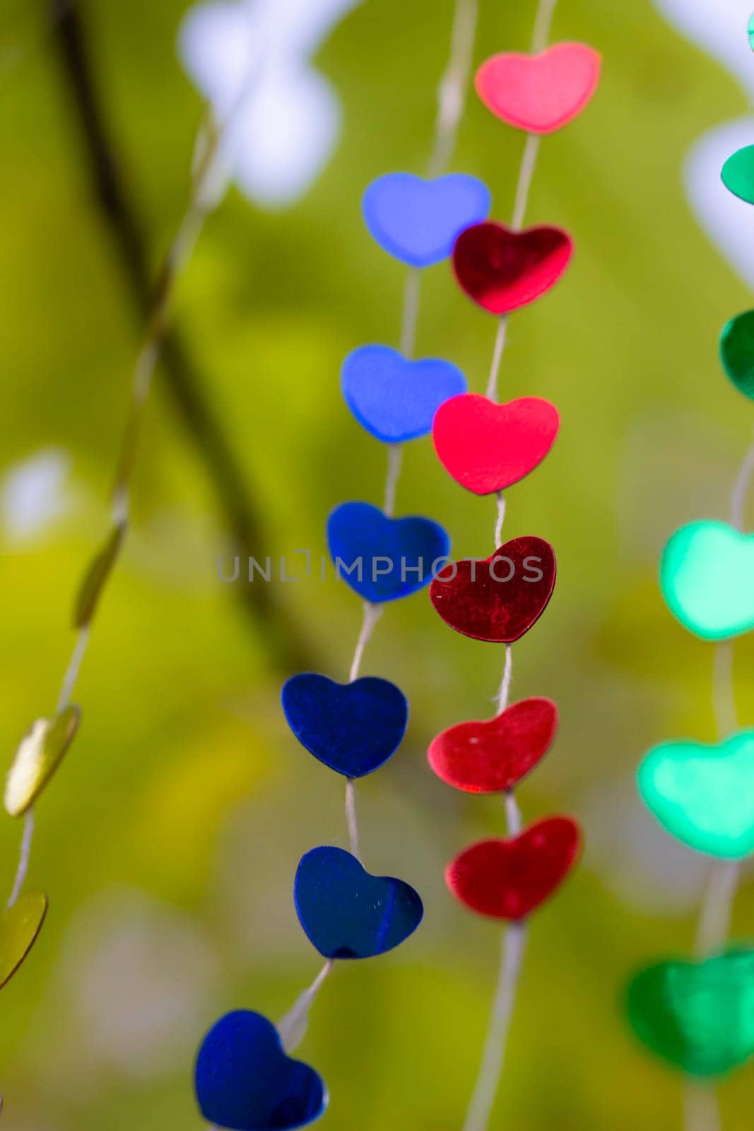 Colored shiny hearts hanging garland for Valentine's Day