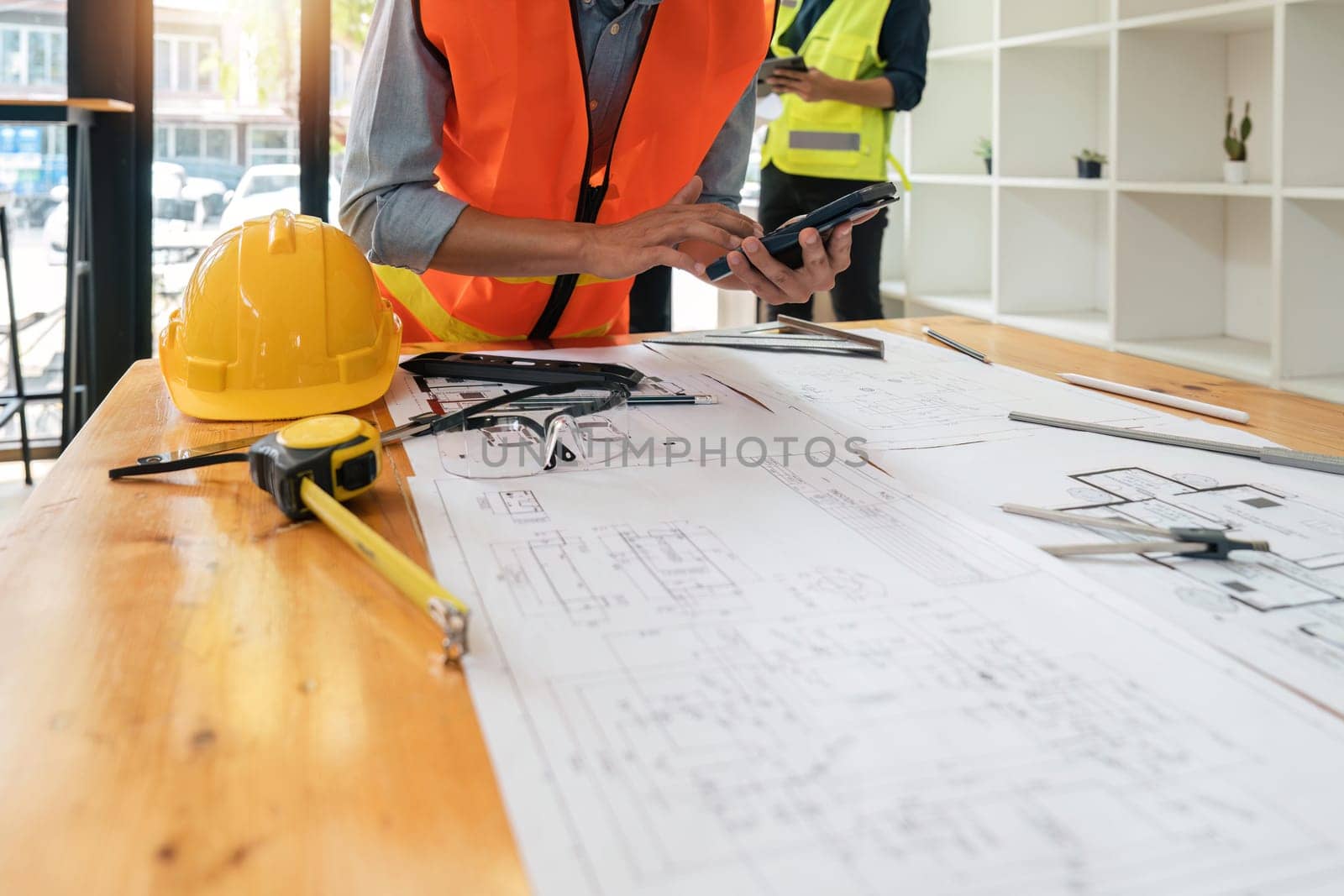 engineer working in office with blueprints, inspection in workplace for architectural plan, construction project ,Business construction.