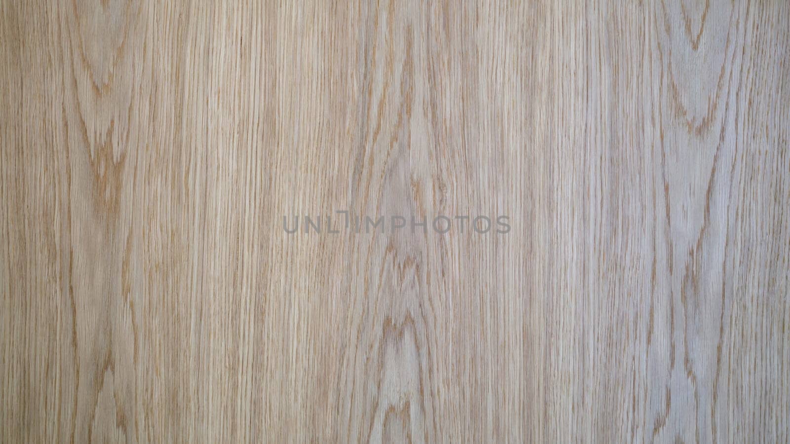 Gray brown surface of wooden board of laminate and parquet background closeup. Floor laying finishing concept