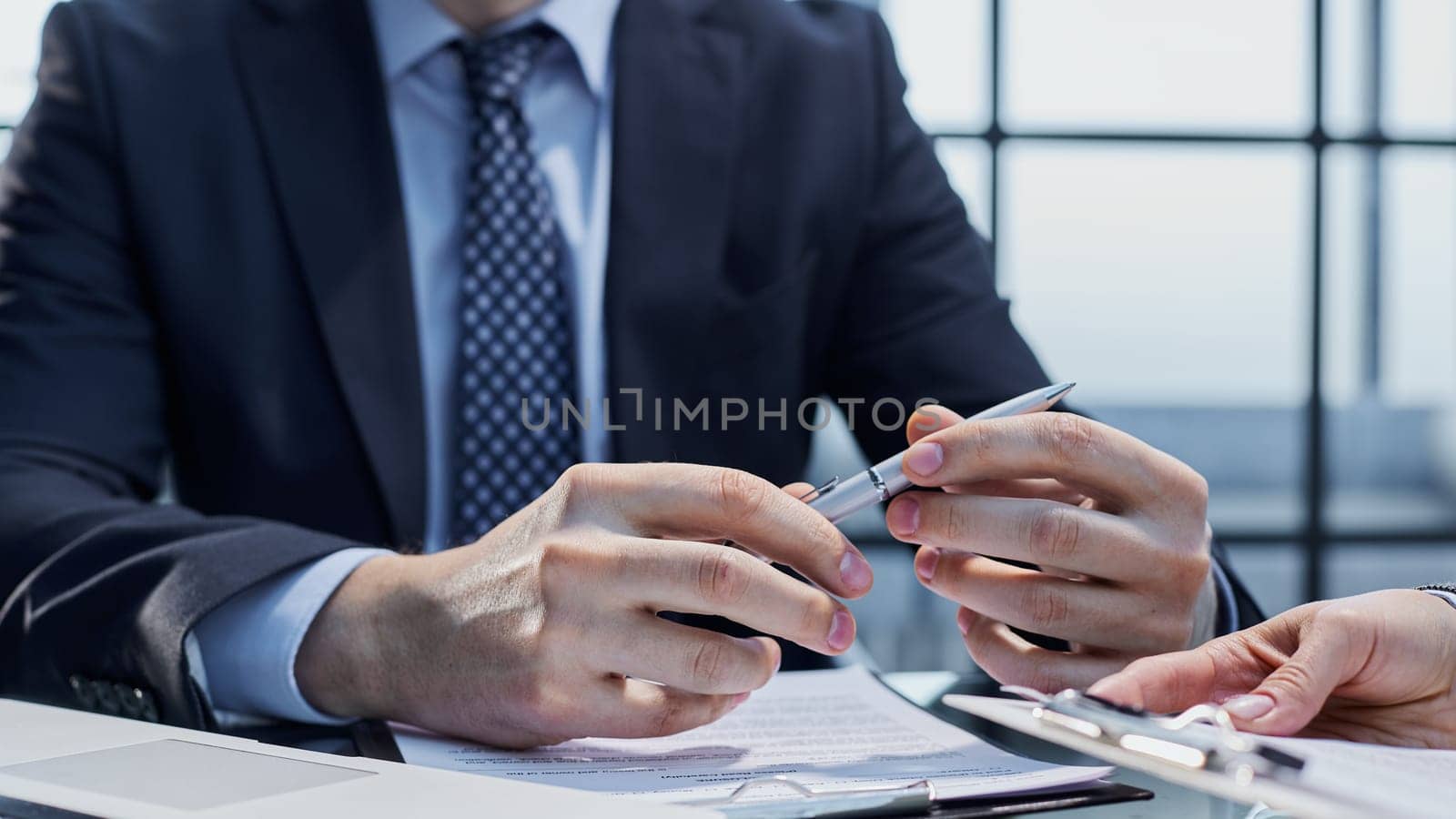 The concept of signing documents and hiring employees.