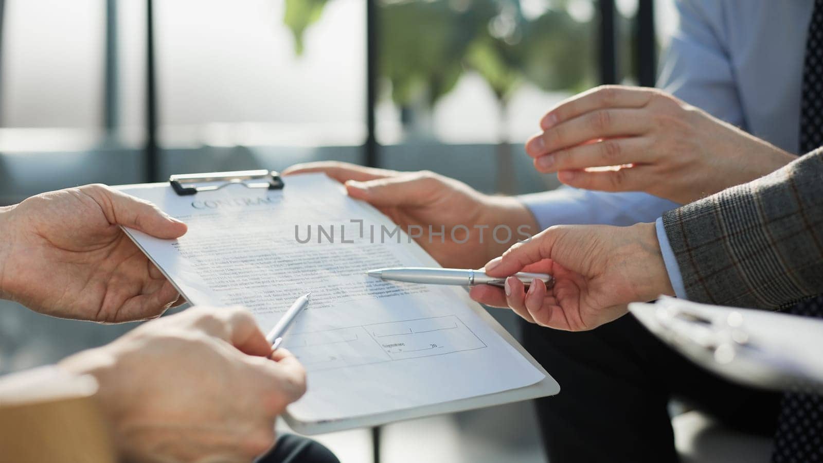 Man exchanging contract or document for signing