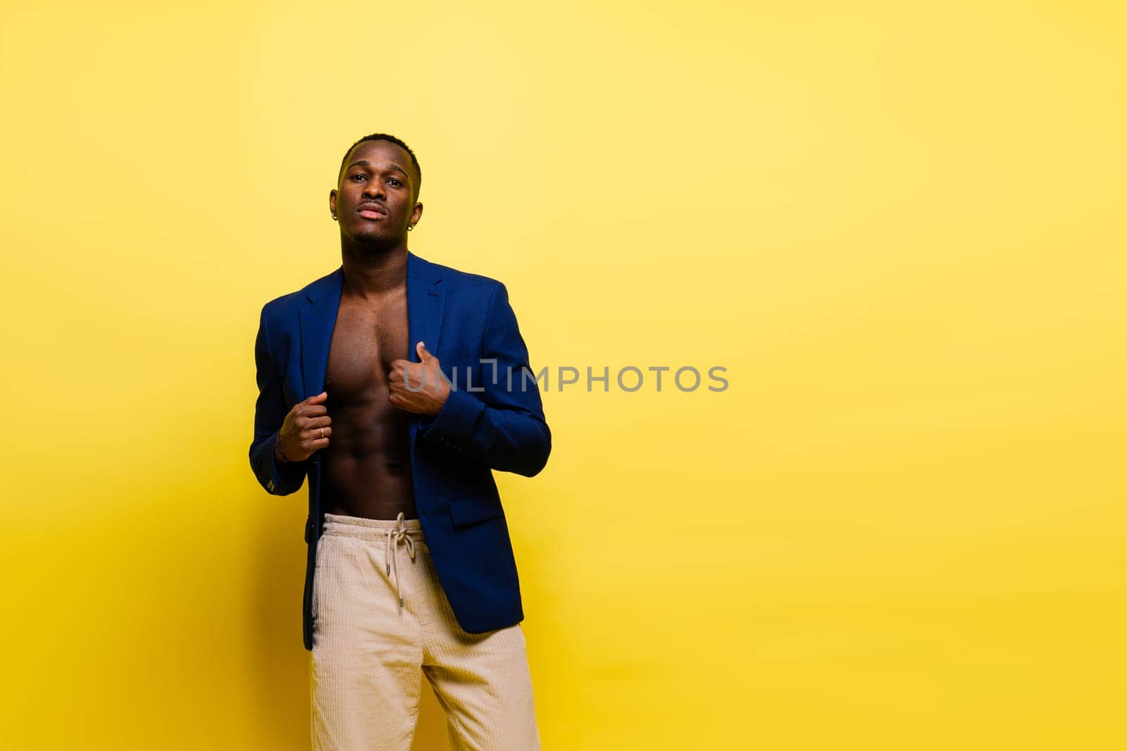 African American millennial businessman isolated on a studio background, successful male formal suit