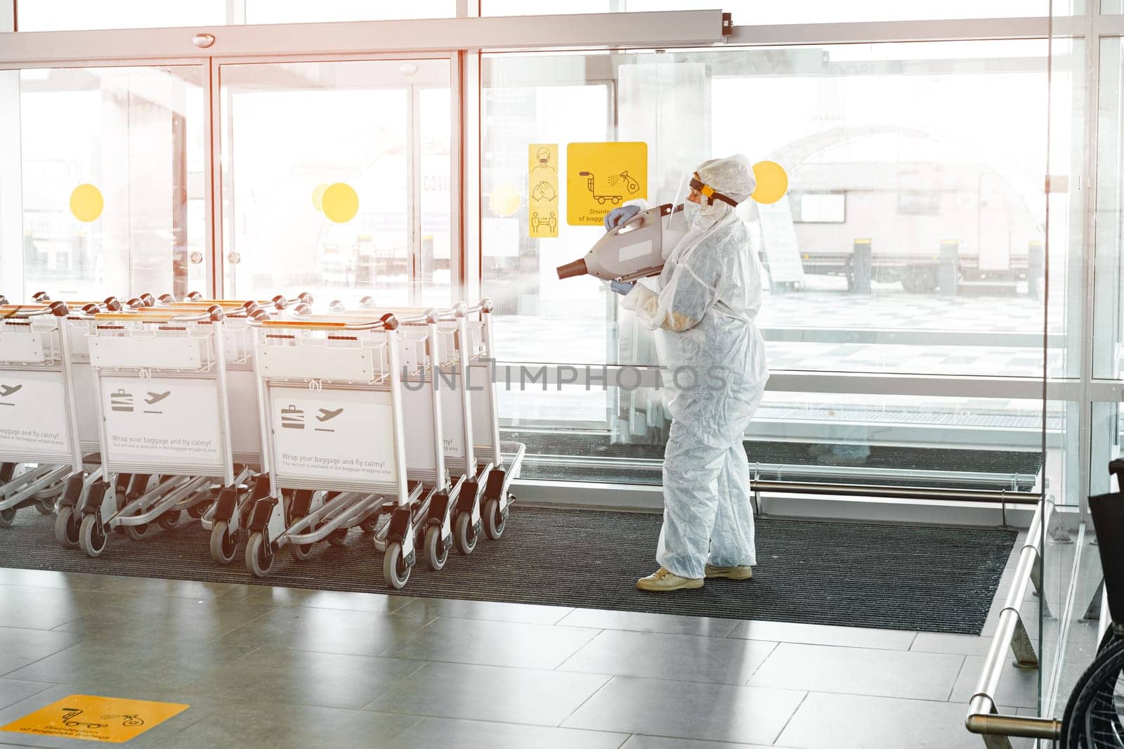 ROSTOV ON DON, RUSSIAN FEDERATION, MARCH, 2021: Sanitary disinfection of airport building preventing the spread of coronavirus infection by Fabrikasimf