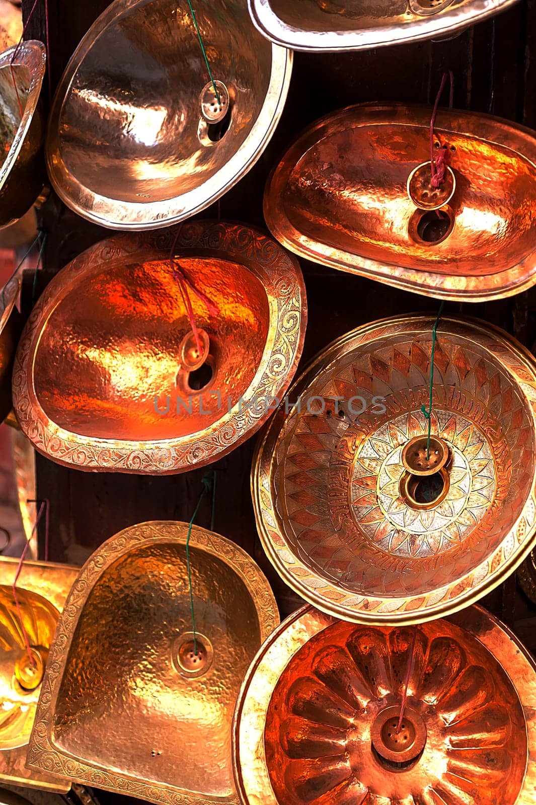 trays for sale at a copper shop in the Medina of Marrakech, Morocco