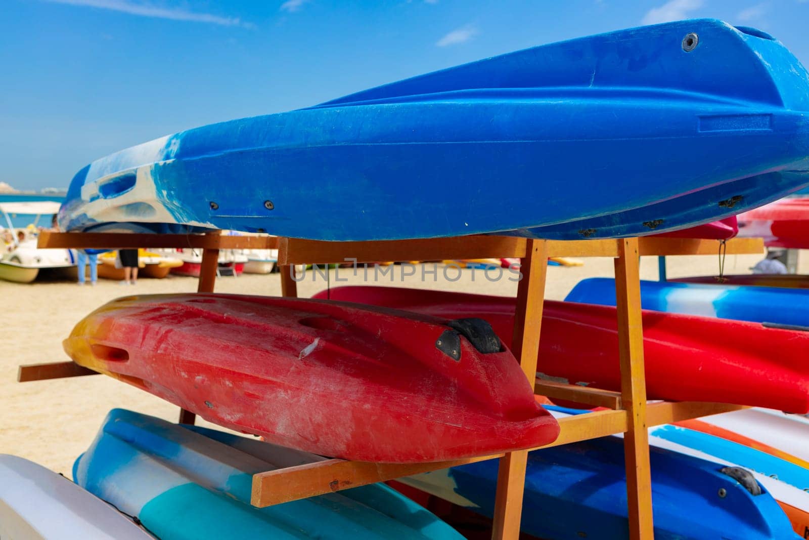 Surfboards stacked on the rack on a beach, close up